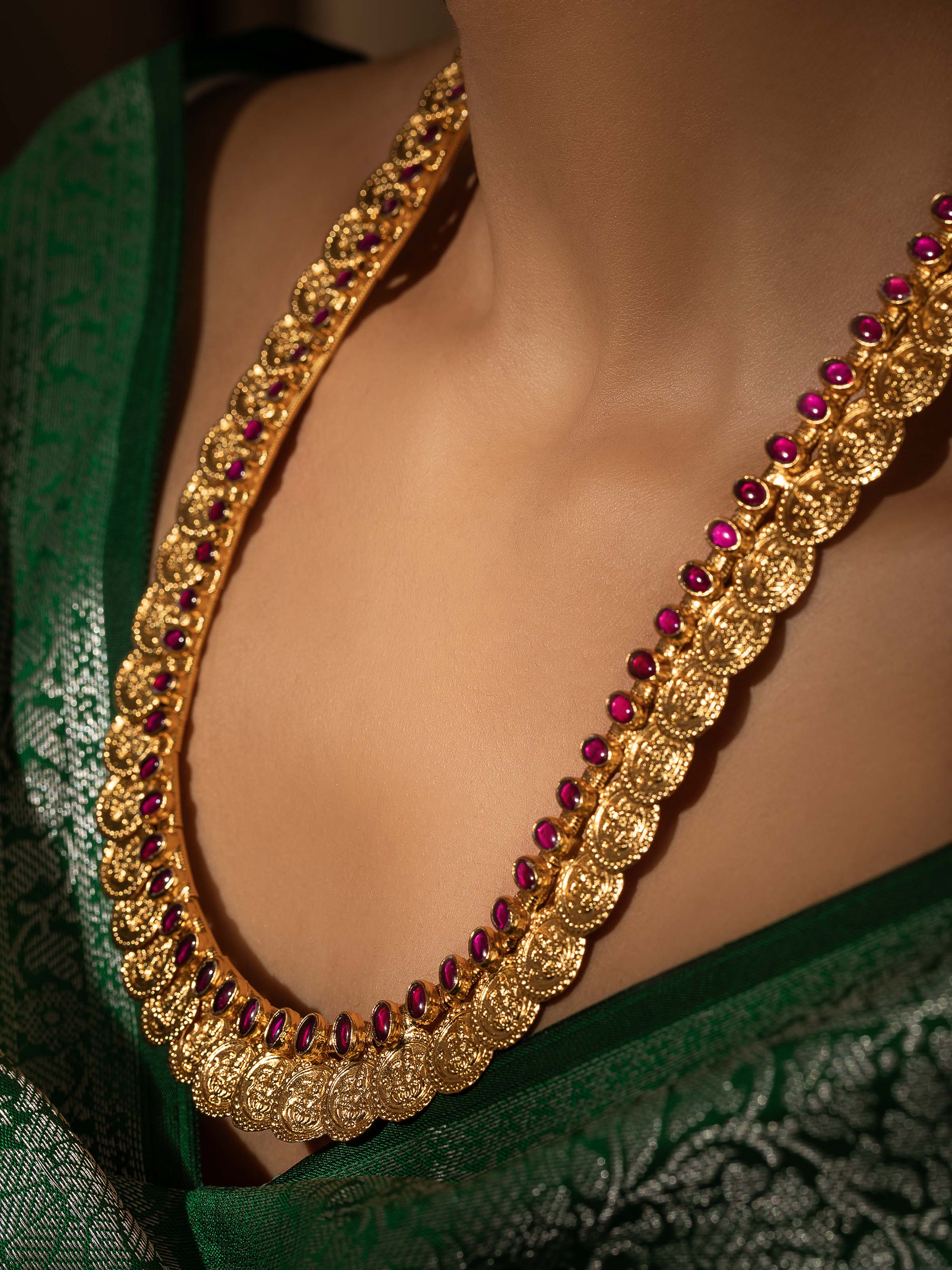 Side view of Silversmithing Collar Necklace highlighting its smooth silver surface and design details