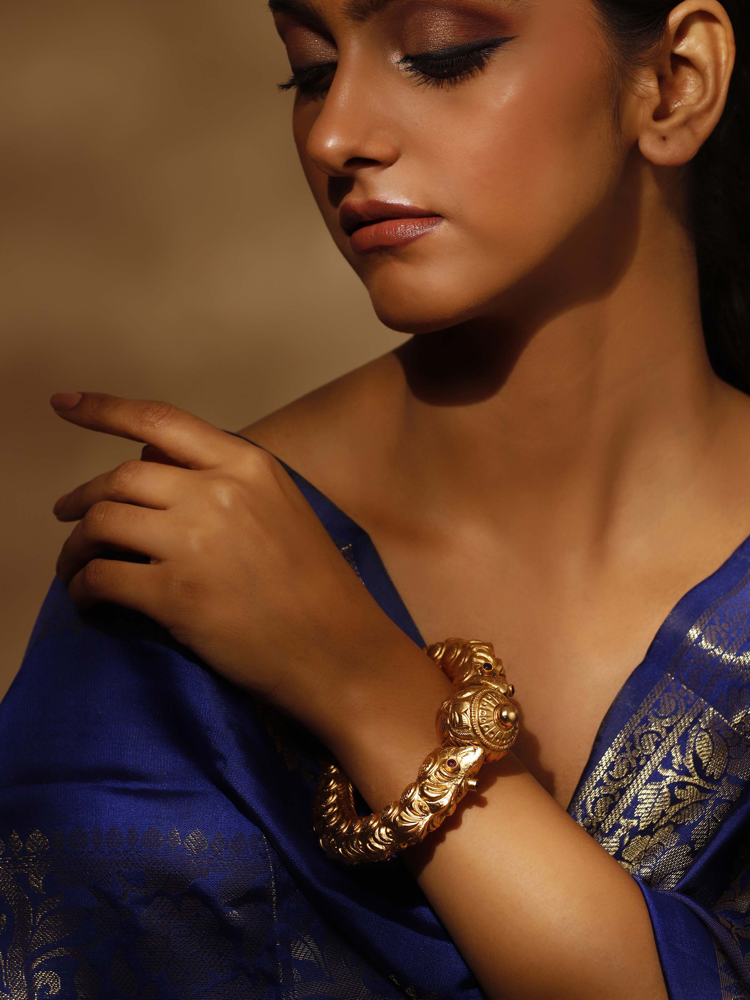 Close-up of Silversmithing Kada highlighting intricate silver work.