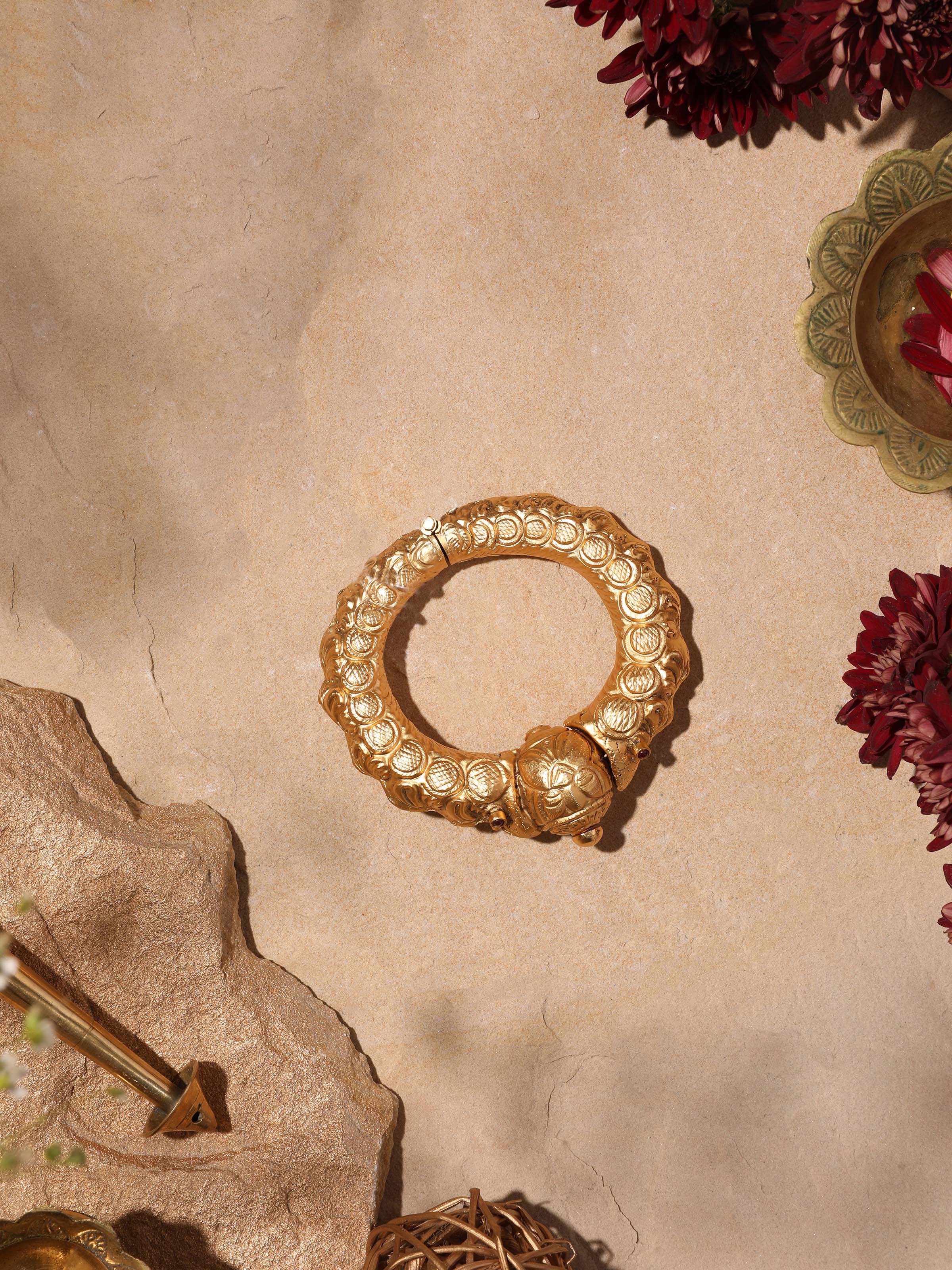 Angled view of Silversmithing Kada showcasing detailed silver work.