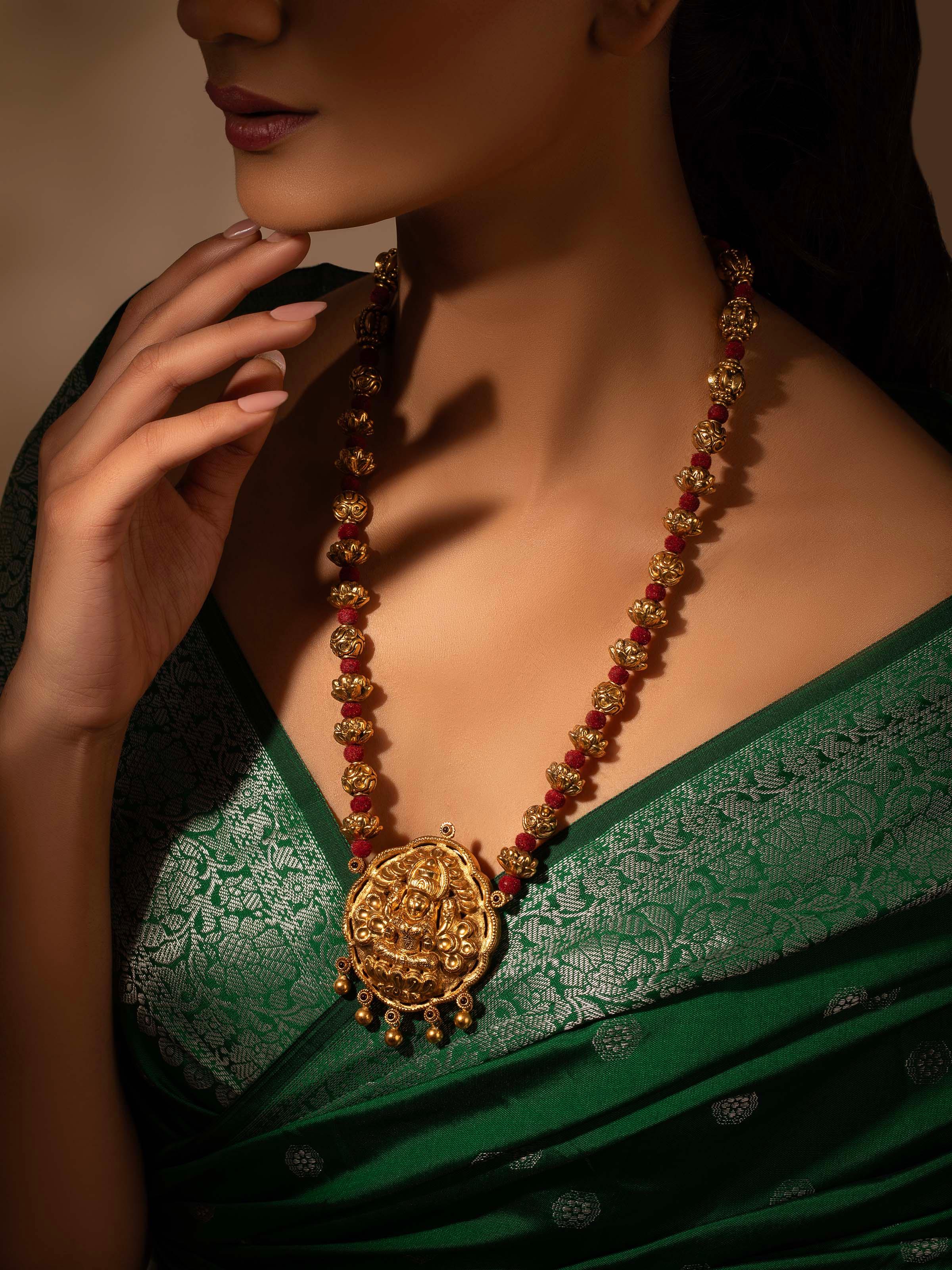 Side view of Silversmithing Long Necklace showcasing its intricate silver work and graceful design