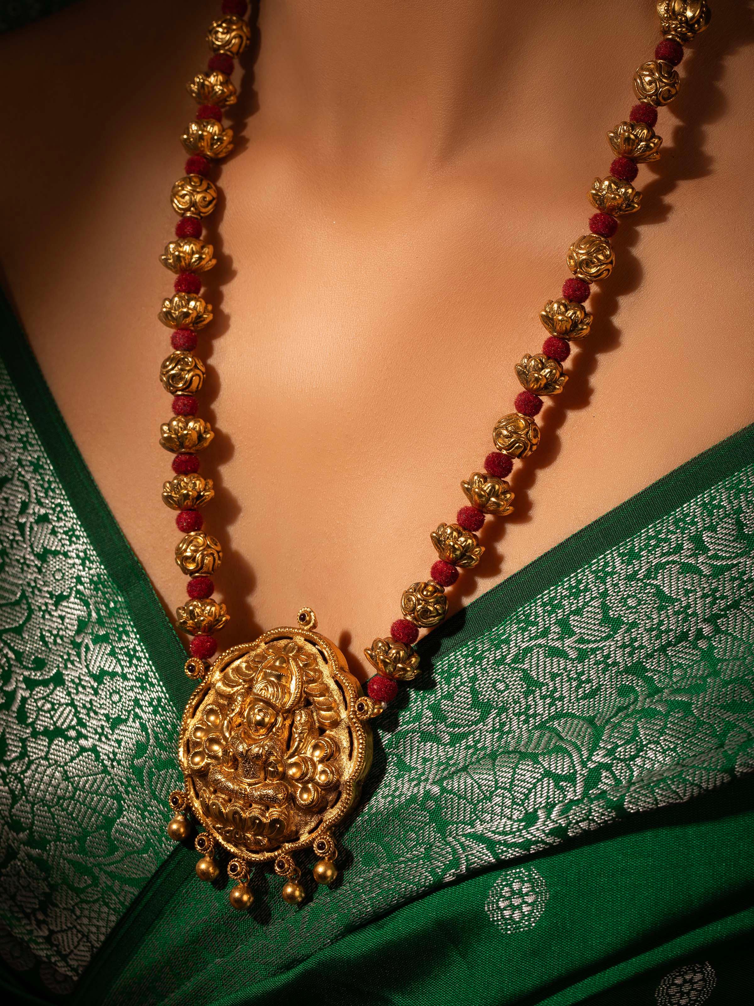 Angled view of Silversmithing Long Necklace emphasizing the detailed silver craftsmanship and elegant design