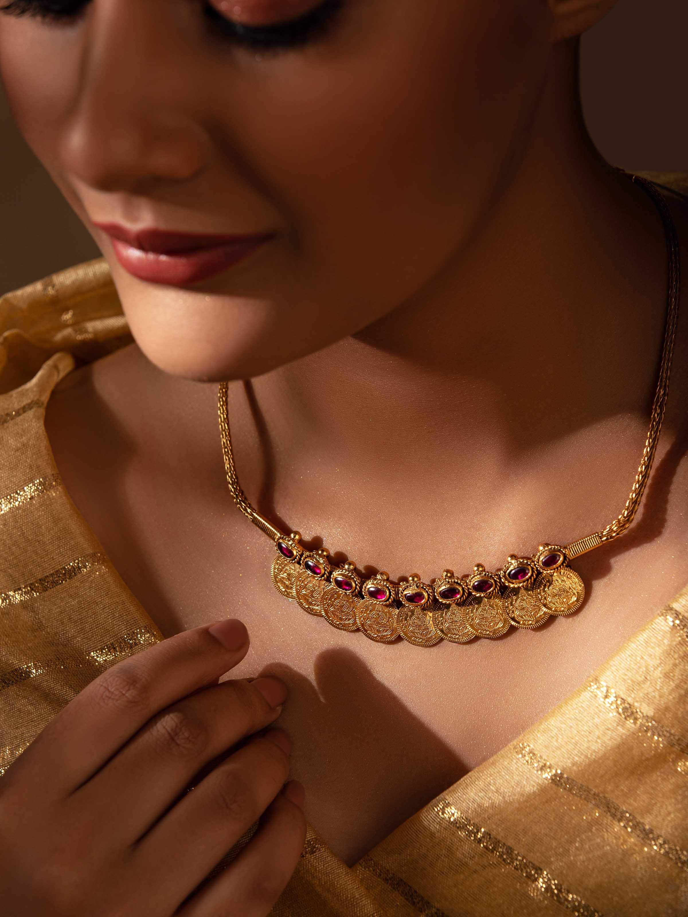 Side view of silversmithing collar necklace highlighting its sleek design and refined finish.