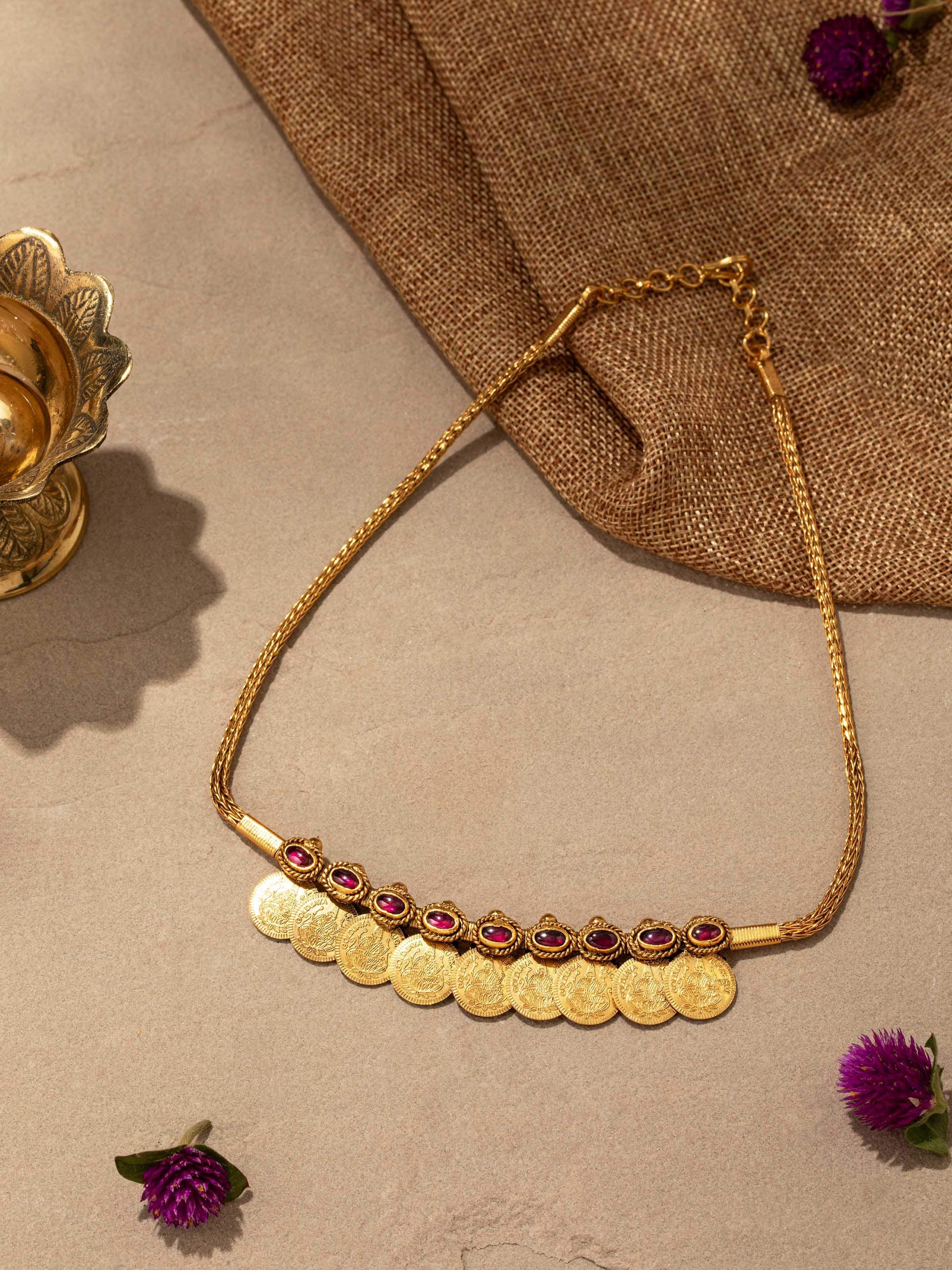 Detailed close-up of silversmithing collar necklace showcasing the craftsmanship and texture of the silver.