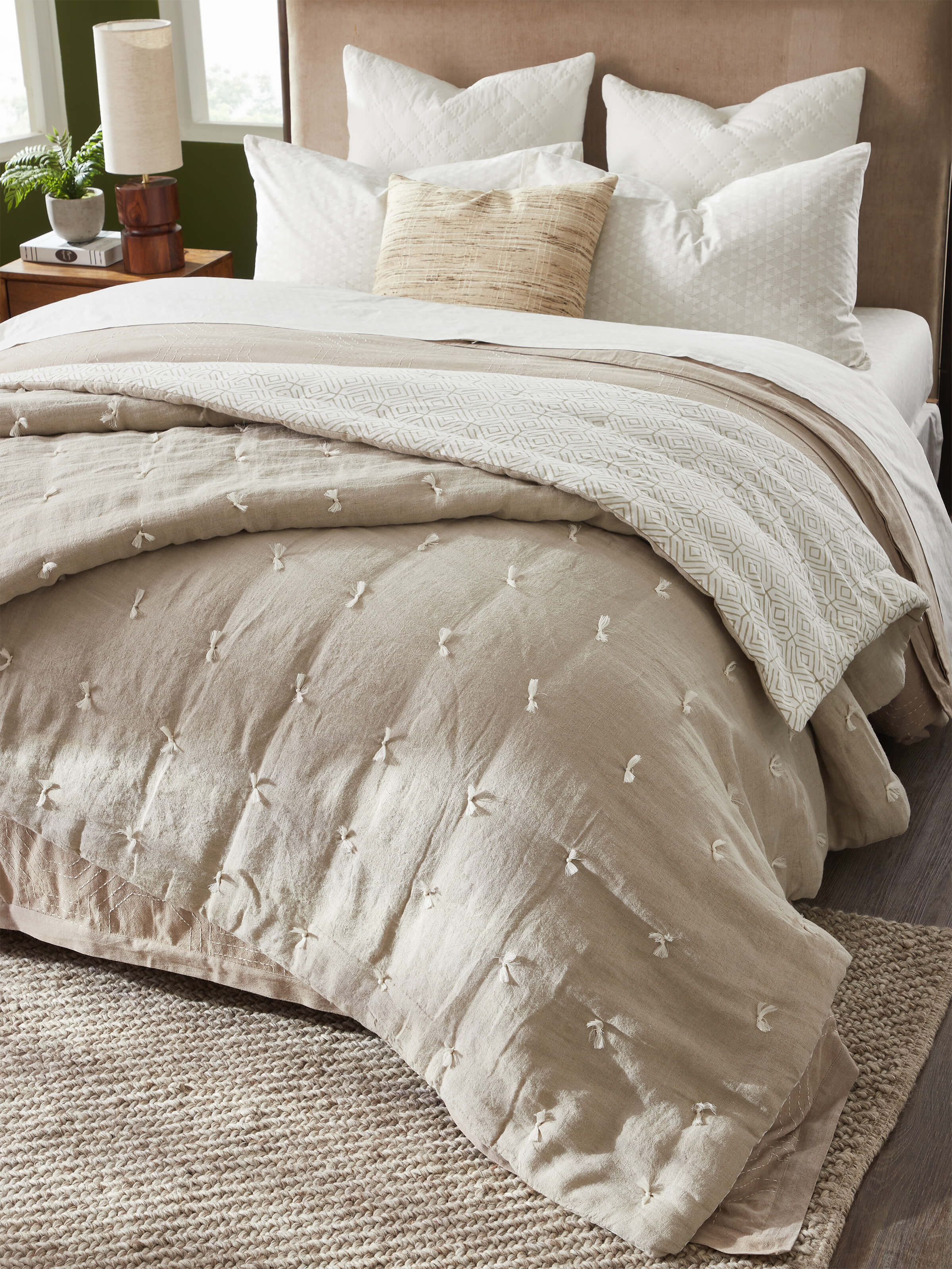 Close-up of Anuthi Beige Solid Linen Razai Embroidered Double Quilt, highlighting the detailed embroidery and linen fabric.