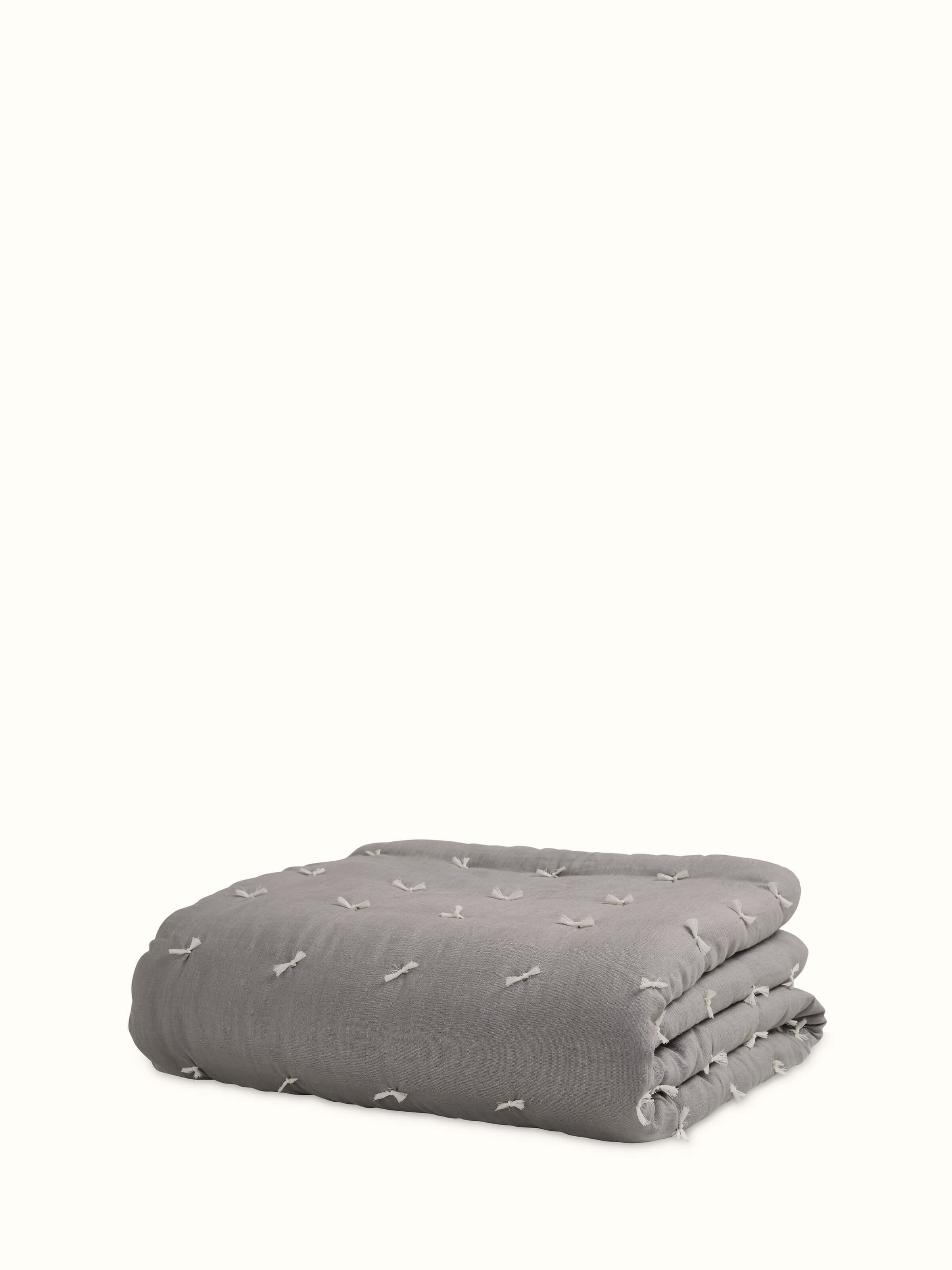 Full view of Anuthi grey solid linen razai embroidered double quilt highlighting the quilt's size and design