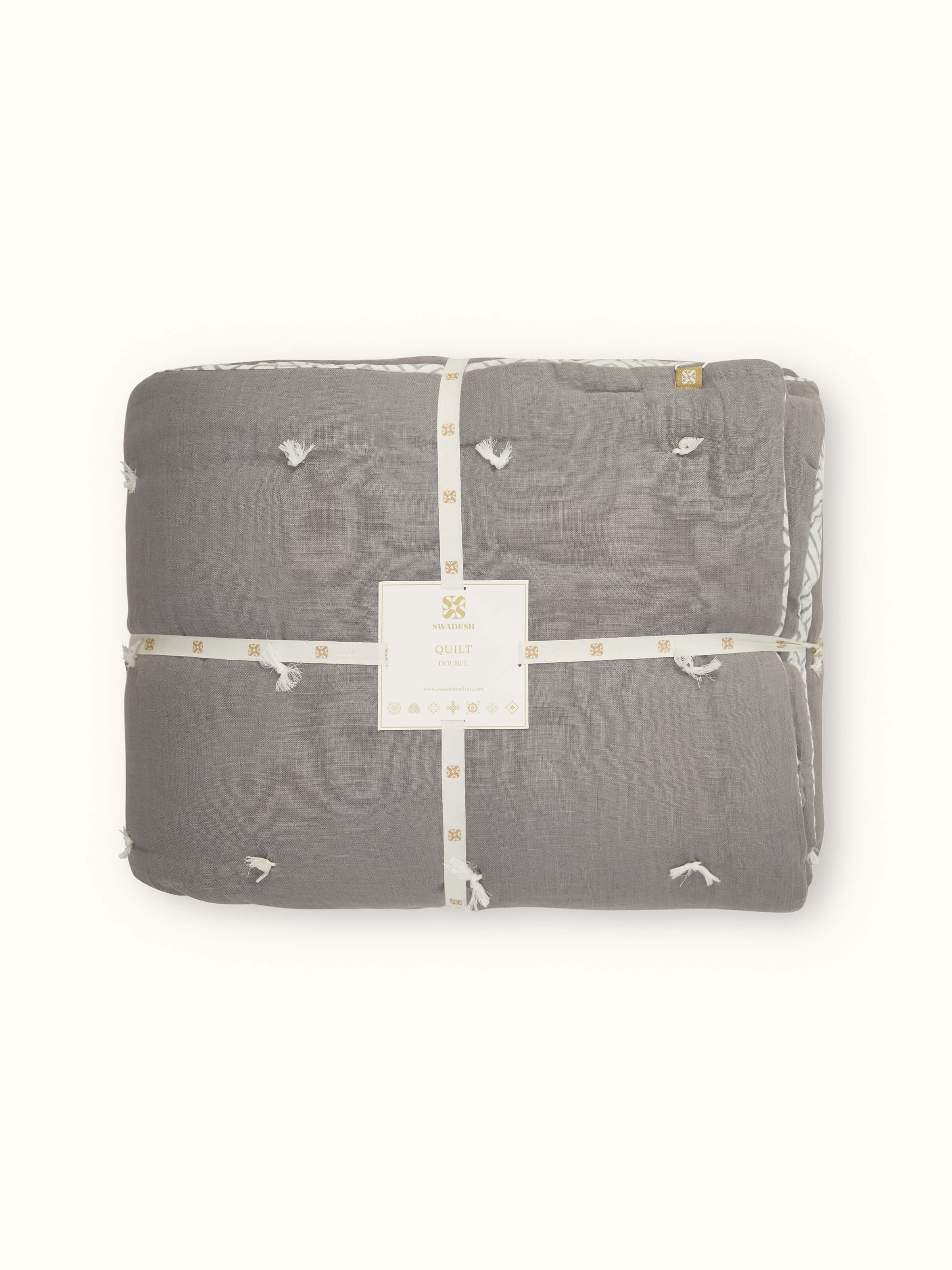 Detailed view of Anuthi grey solid linen razai embroidered double quilt focusing on its linen texture and embroidery