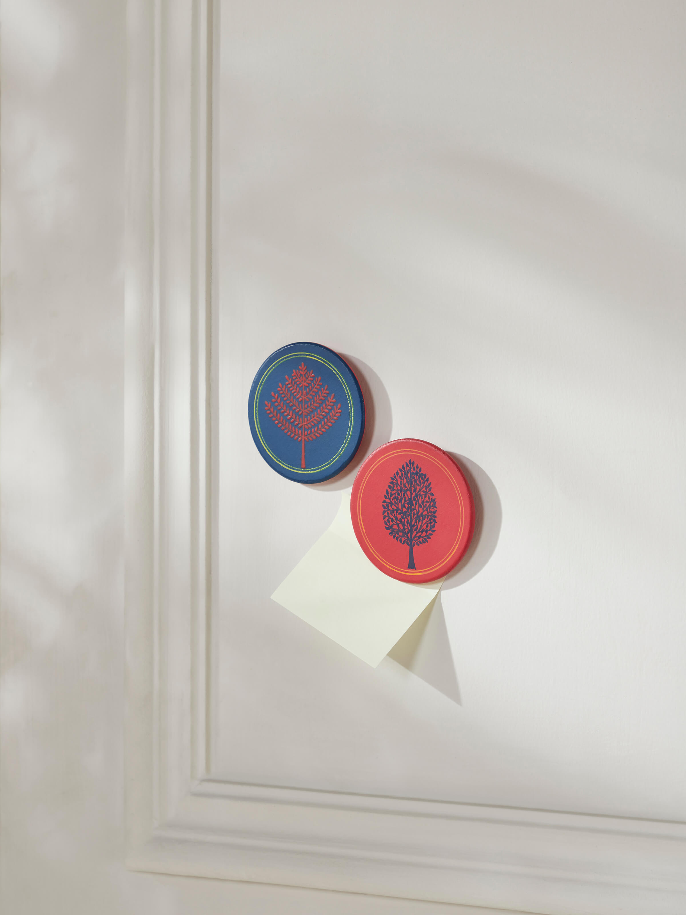 Close-up of Pattachitra tree of life fridge magnets highlighting intricate details