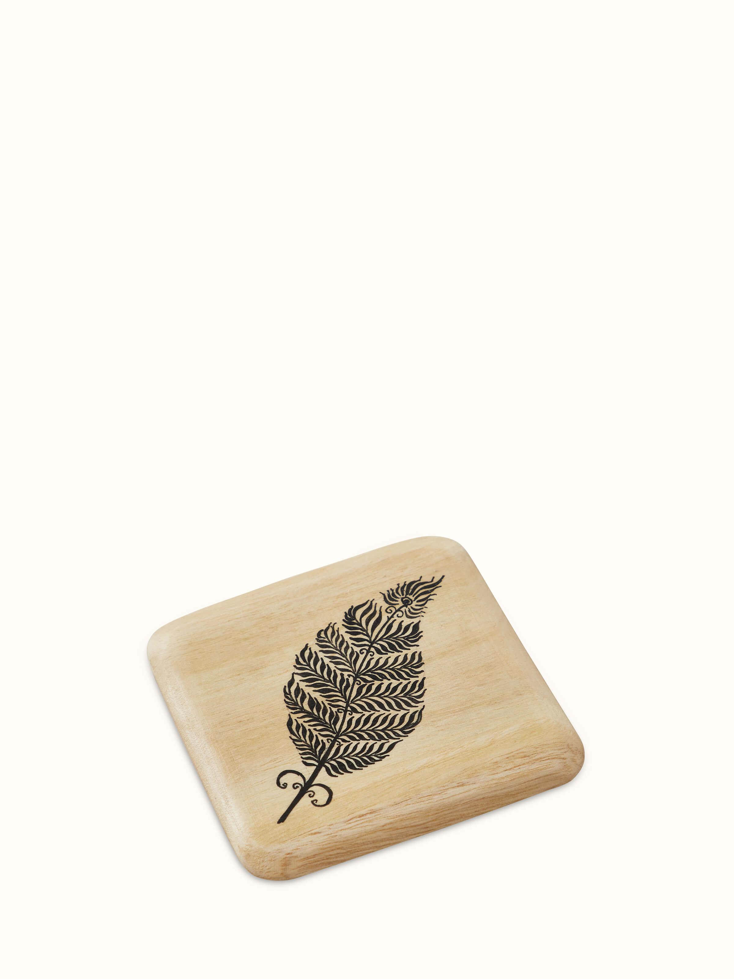 Detailed view of Carved Gamhar Wood Coasters (Black) with rich texture.