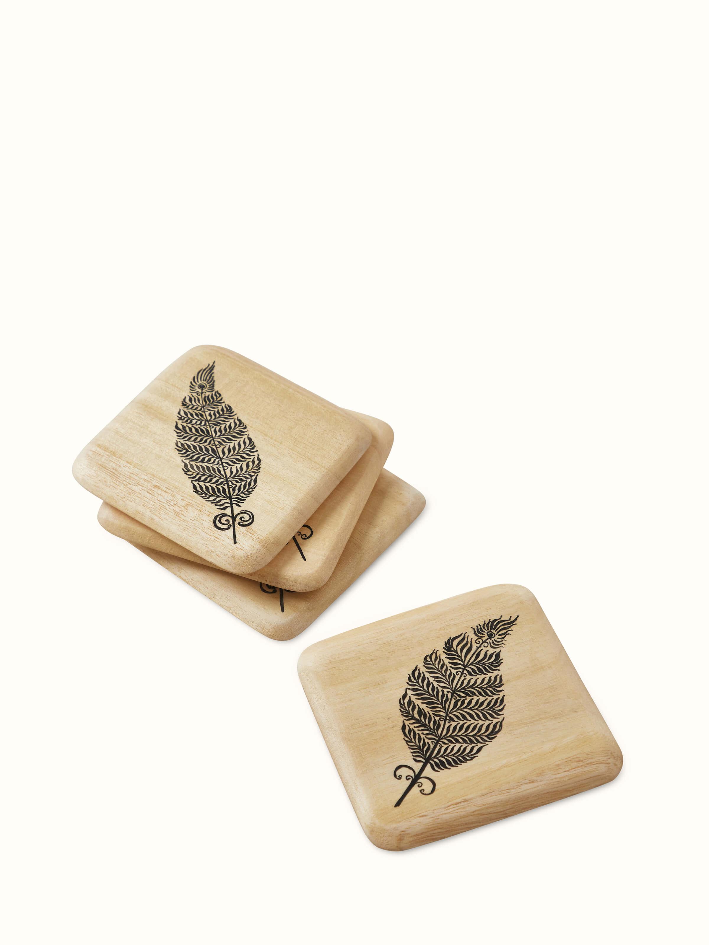 Top view of Carved Gamhar Wood Coasters (Black) emphasizing the craftsmanship.