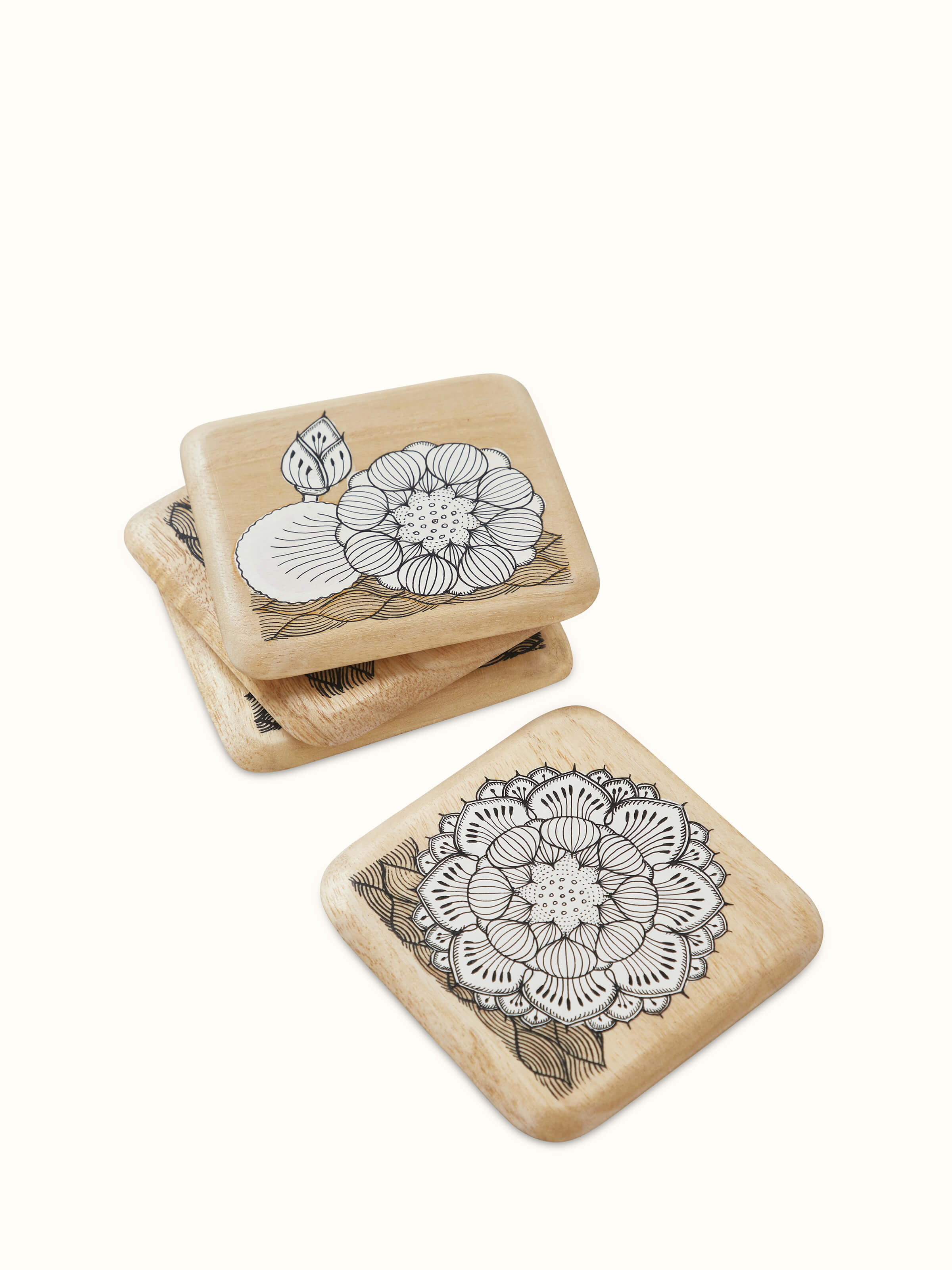 Top view of Carved Gamhar Wood Coasters in White & Black (4 pcs) showcasing the set's design