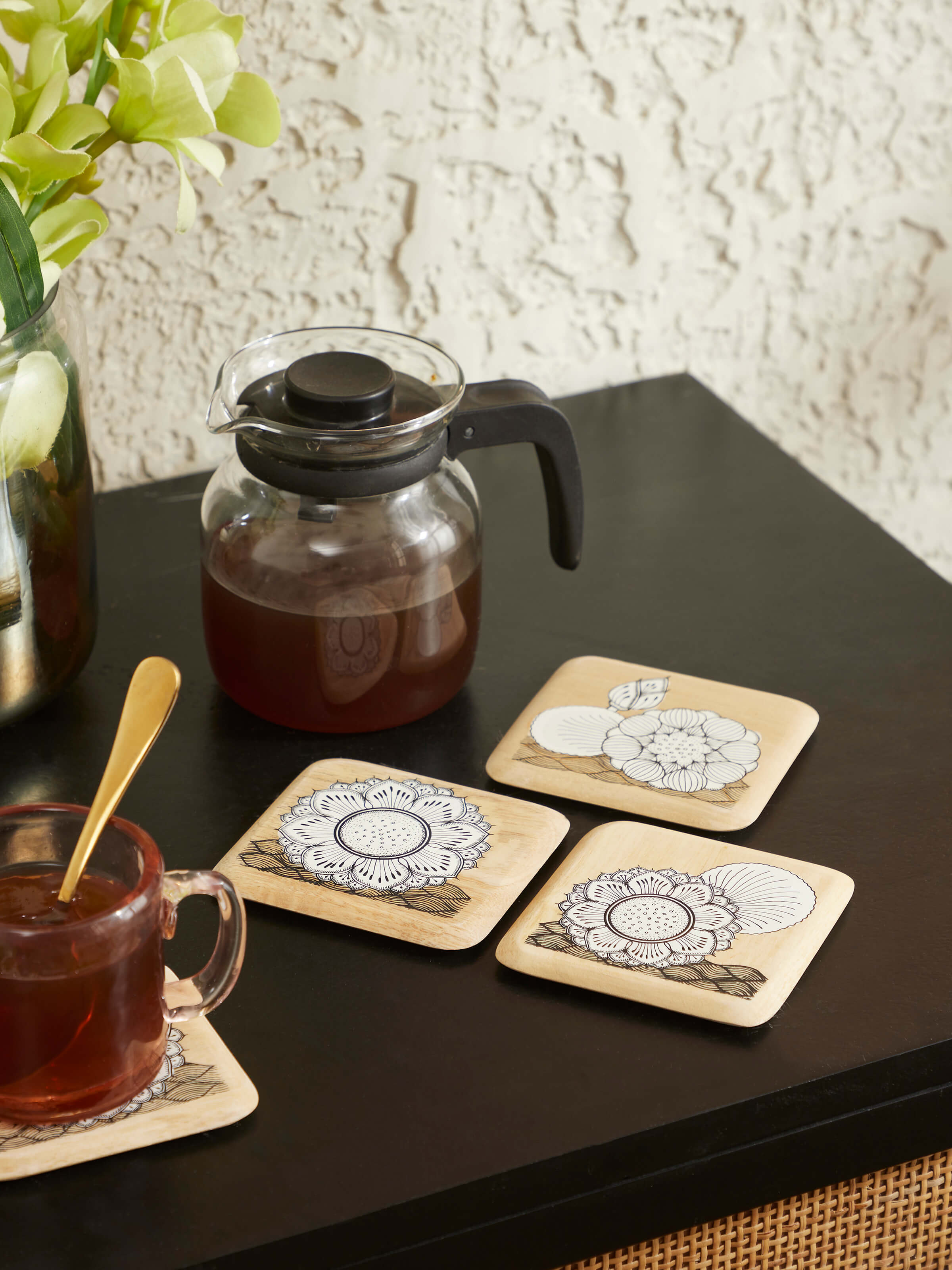 Side view of Carved Gamhar Wood Coasters in White & Black (4 pcs) revealing elegant design