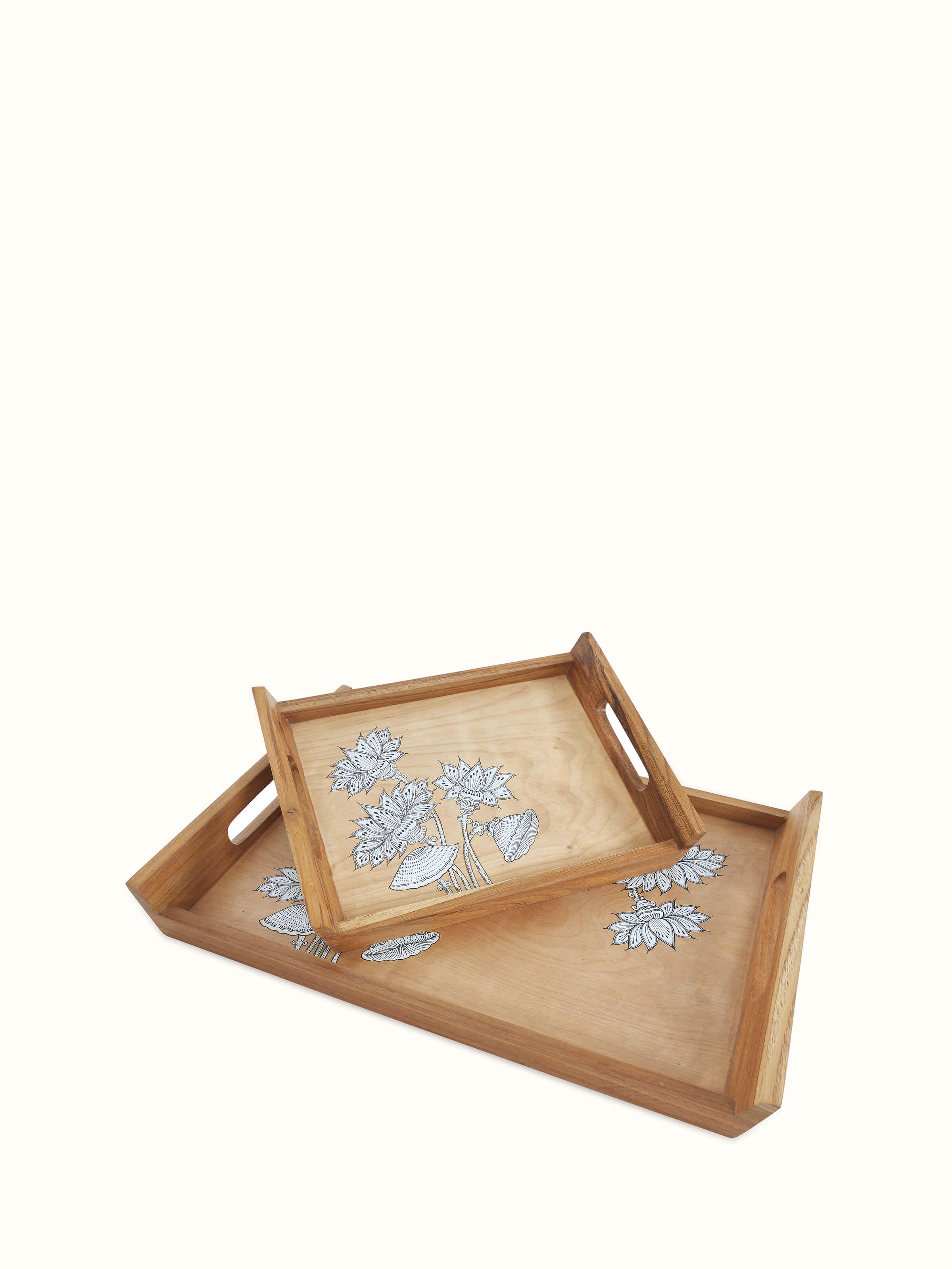 Front view of Carved teak wood trays in brown (2 pcs) showcasing the detailed carving and finish