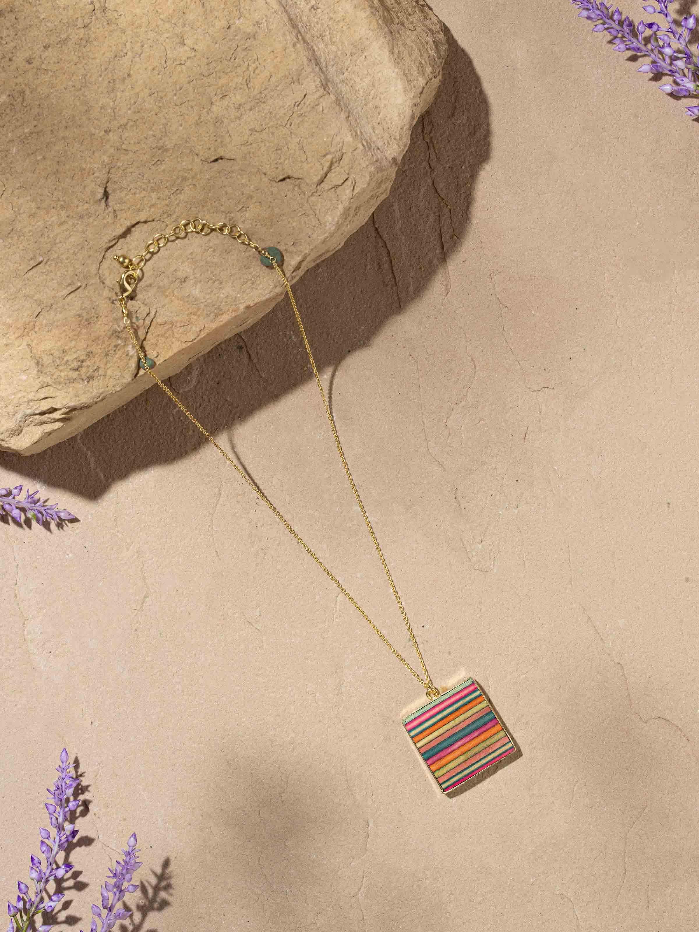 Close-up side angle highlighting detailed wood grain of pendant