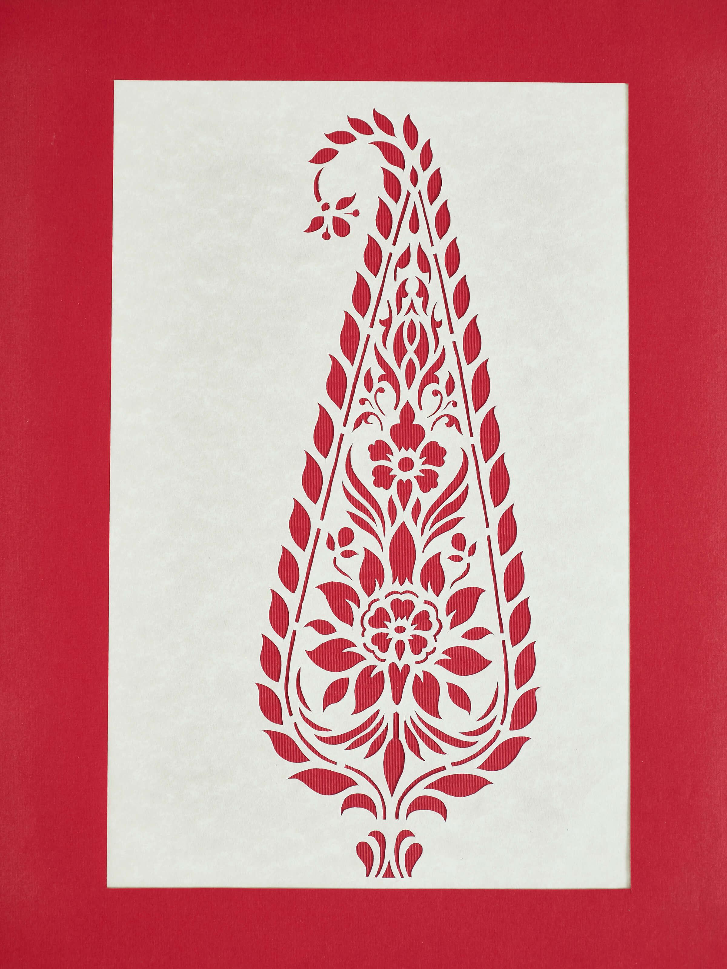Close-up of Sanjhi paper stencil Mughal kairi wall art focusing on delicate patterns.
