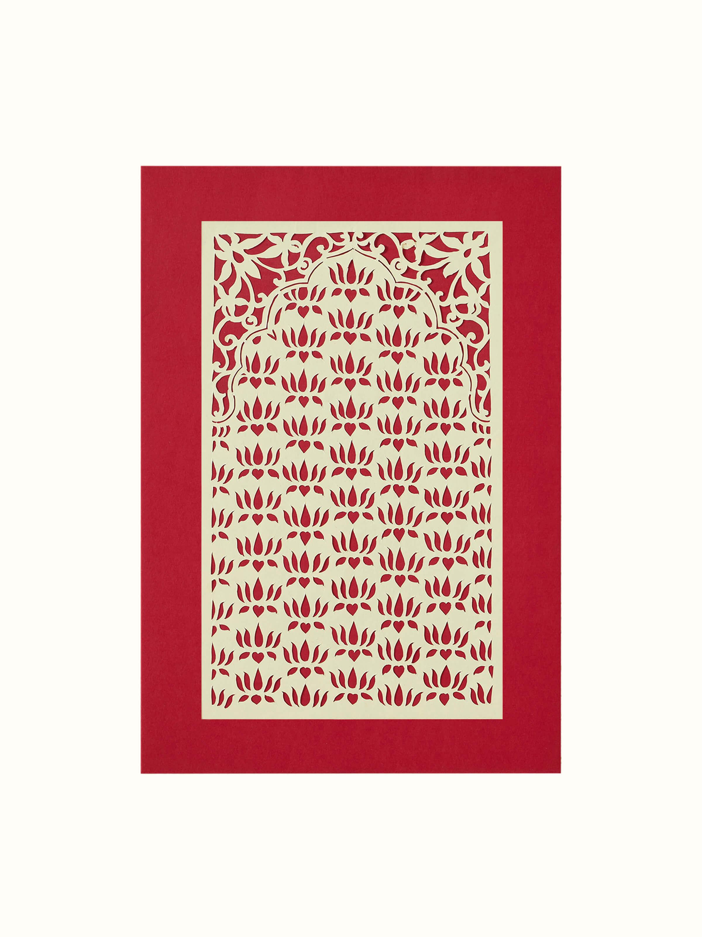Close-up view of Sanjhi paper stencil lotus jaali wall art highlighting delicate lotus motifs and craftsmanship