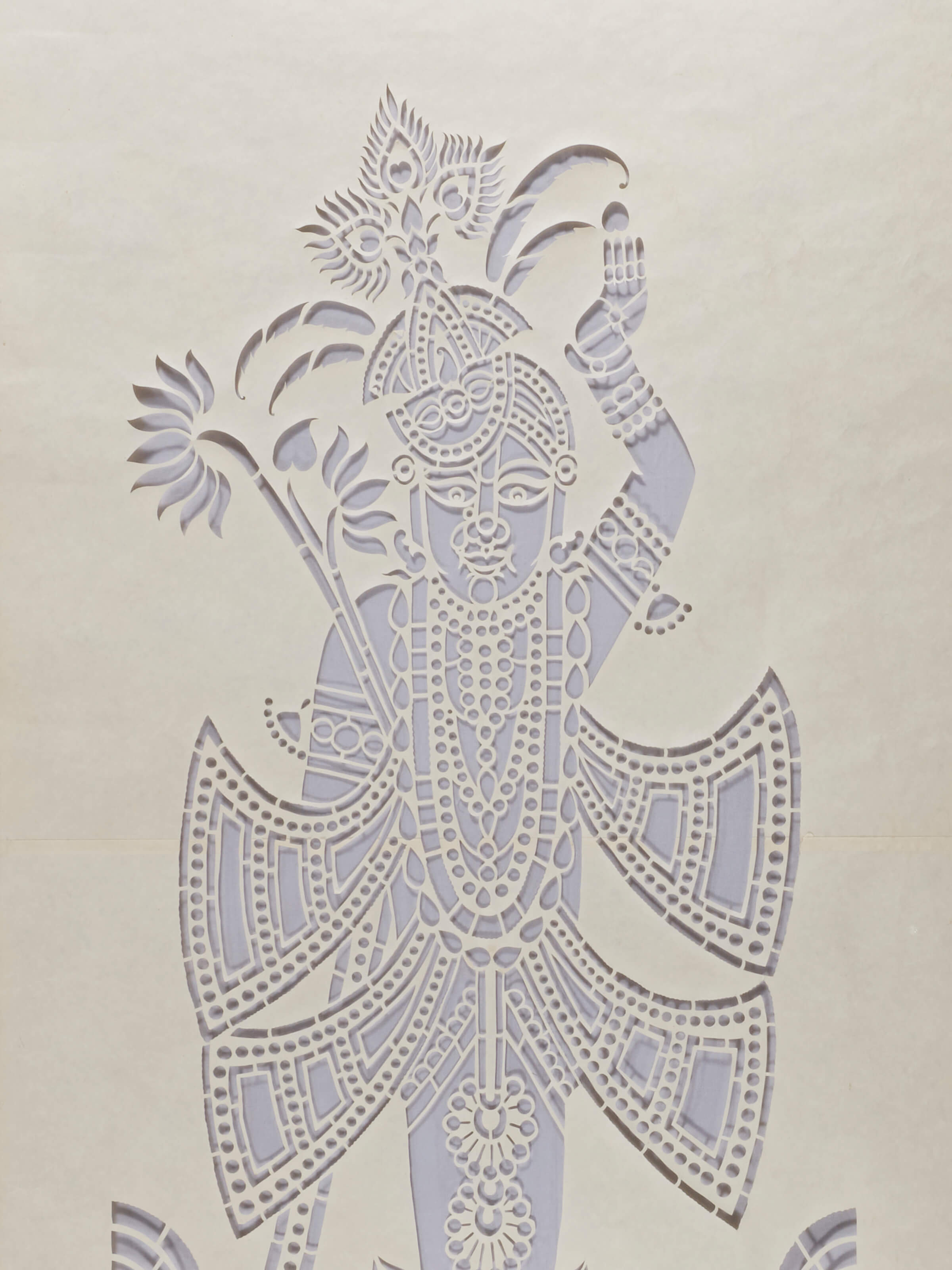 Side view of Sanjhi paper stencil wall art displaying detailed patterns and traditional craftsmanship