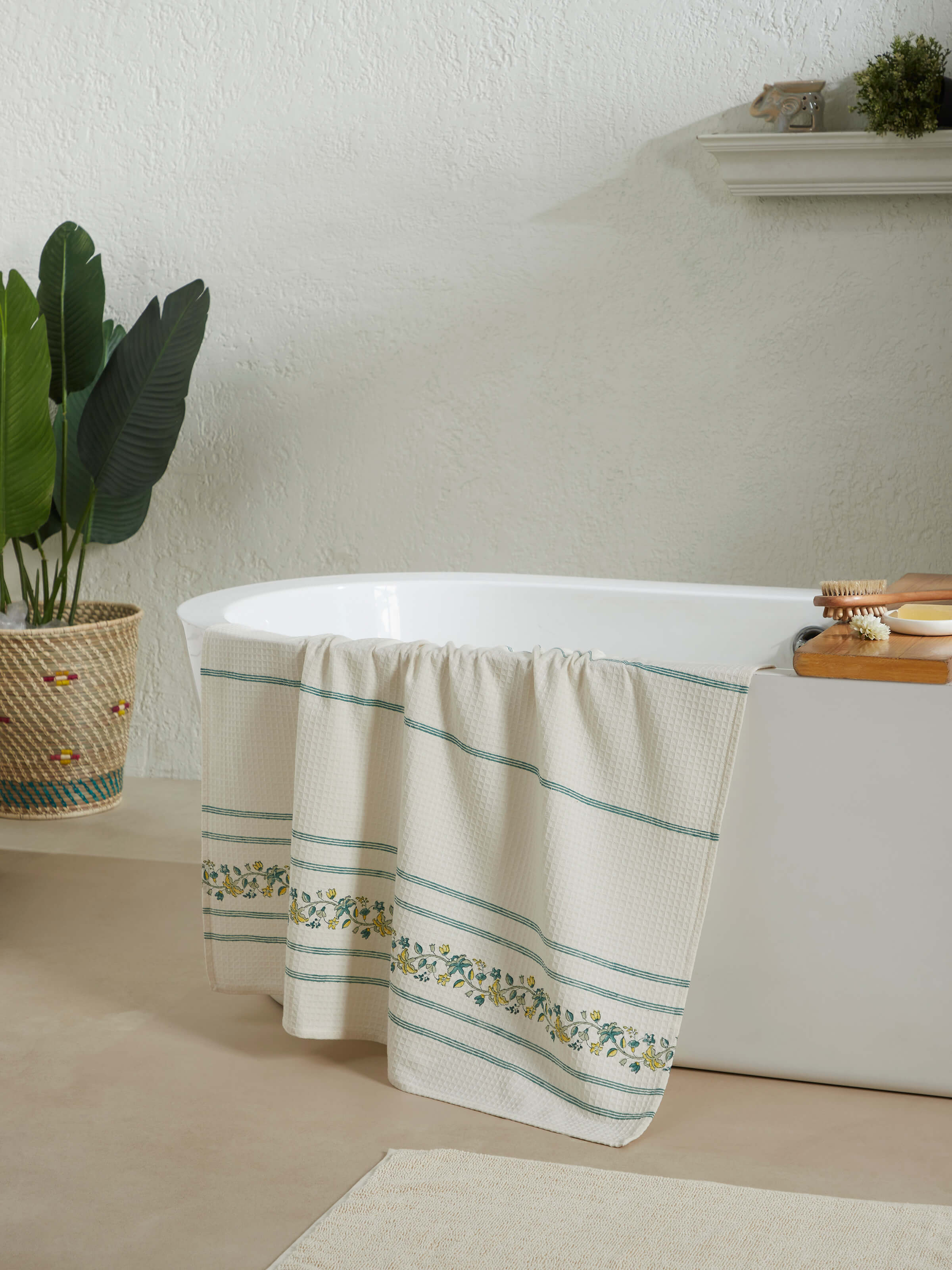 Close-up of Palampore stripe yellow floral cotton Sanganeri block printed bath towel (XL) focusing on the detailed floral print and towel texture.