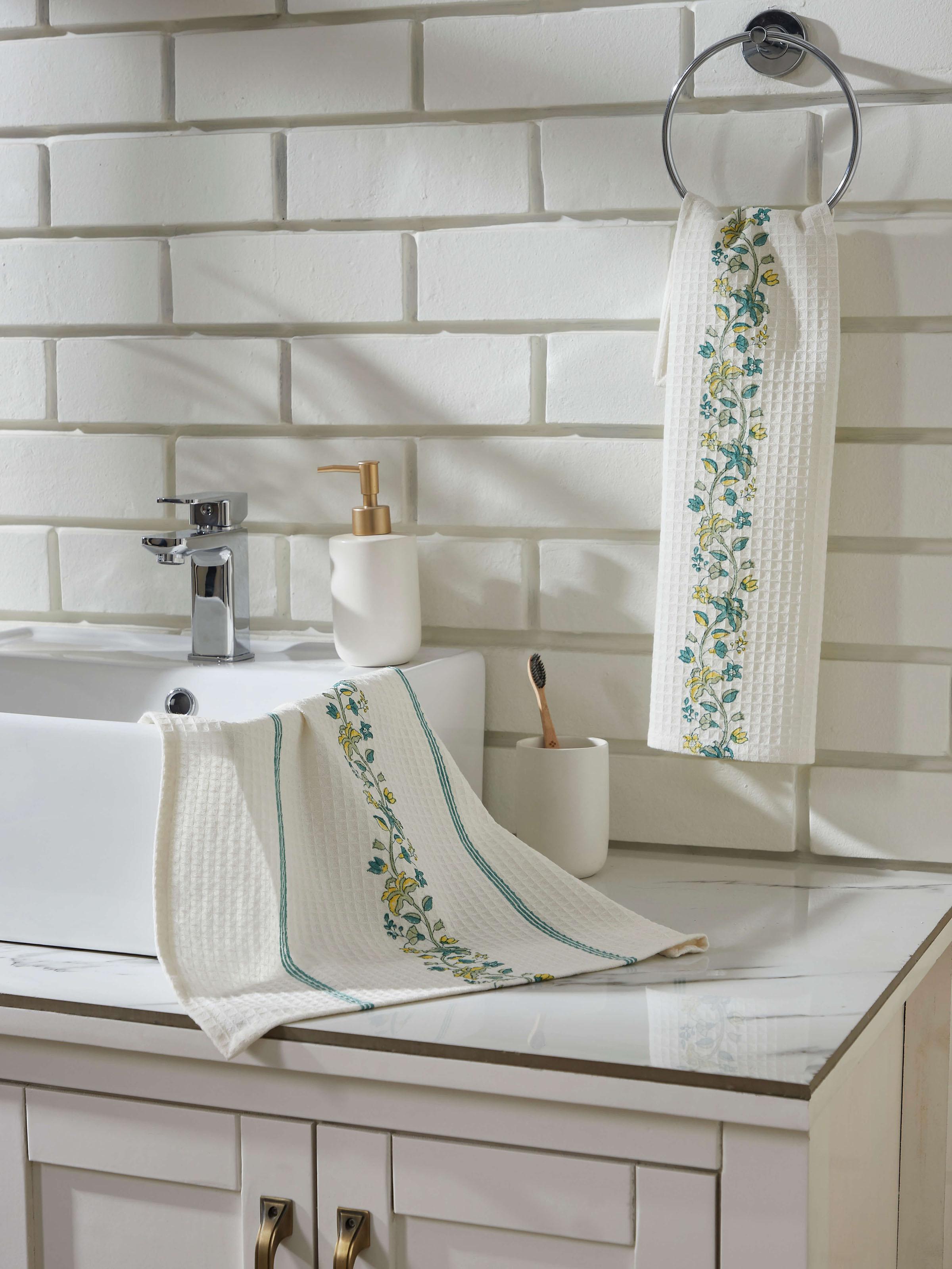 Close-up of Palampore border yellow floral cotton Sanganeri block printed hand towel, showing the intricate block print.