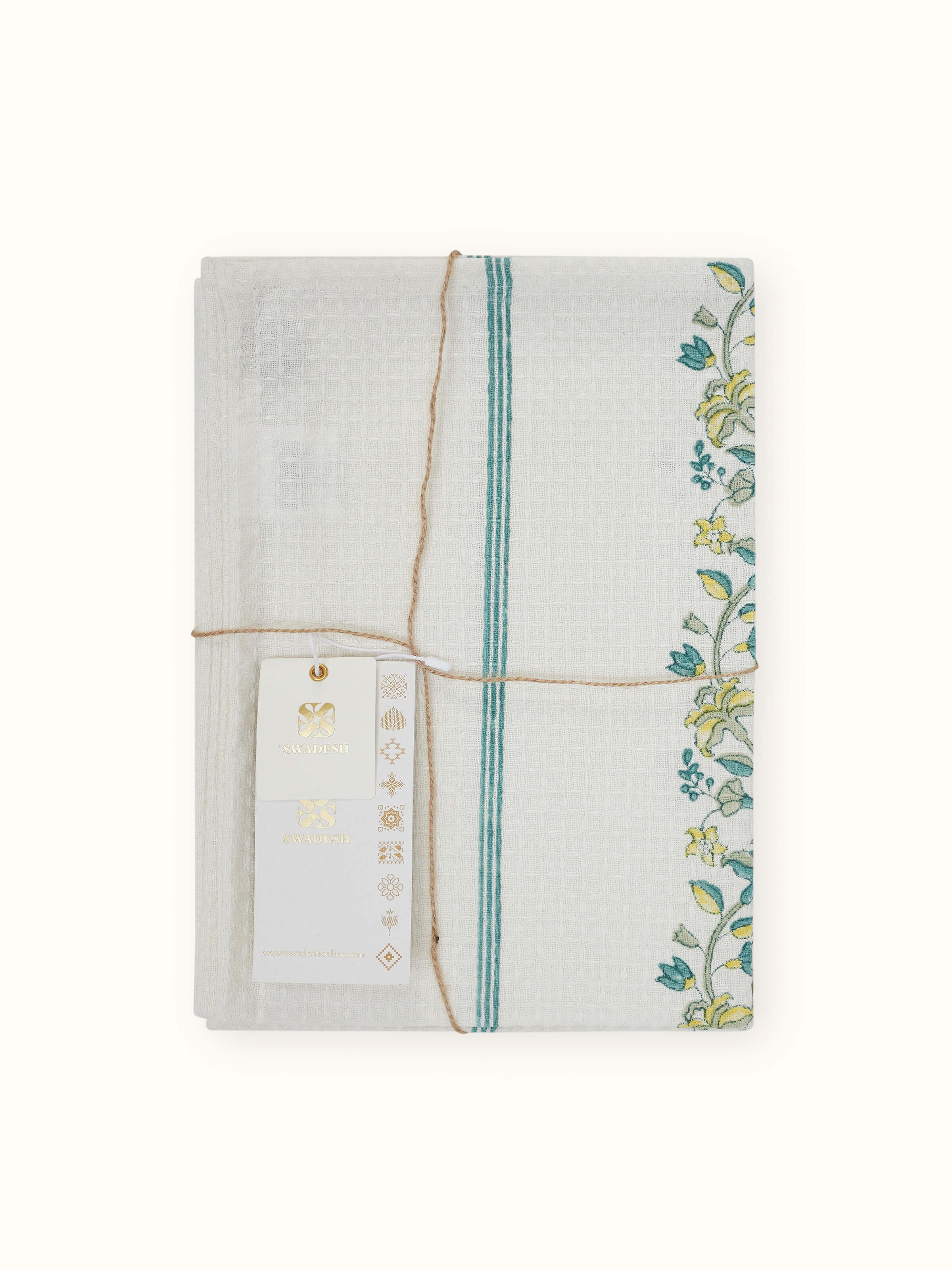 Set of two Palampore border yellow floral cotton Sanganeri block printed hand towels, showcasing the design and fabric.