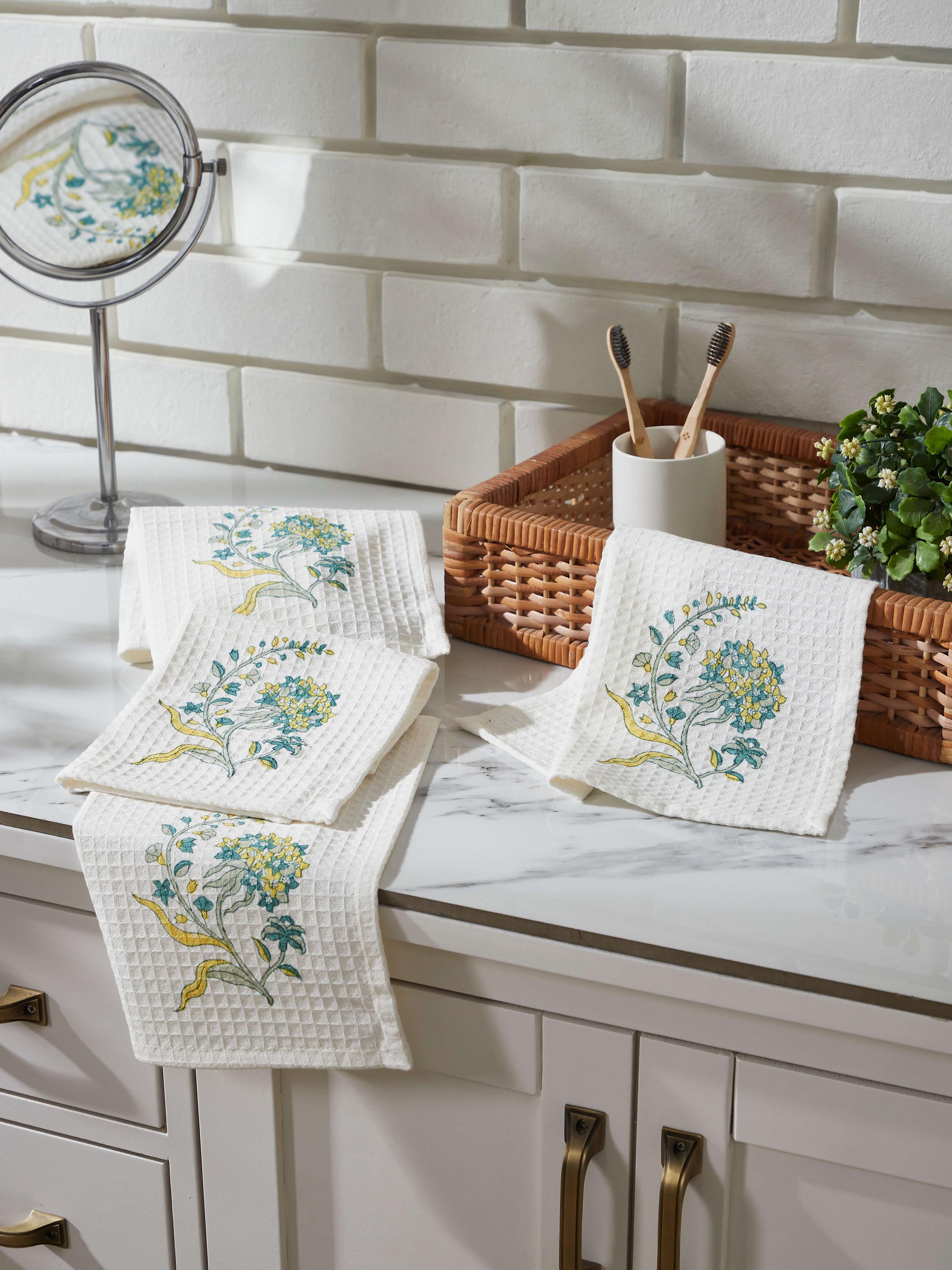 Close-up of Palampore yellow floral cotton Sanganeri block printed face towels displaying the intricate block print and soft texture