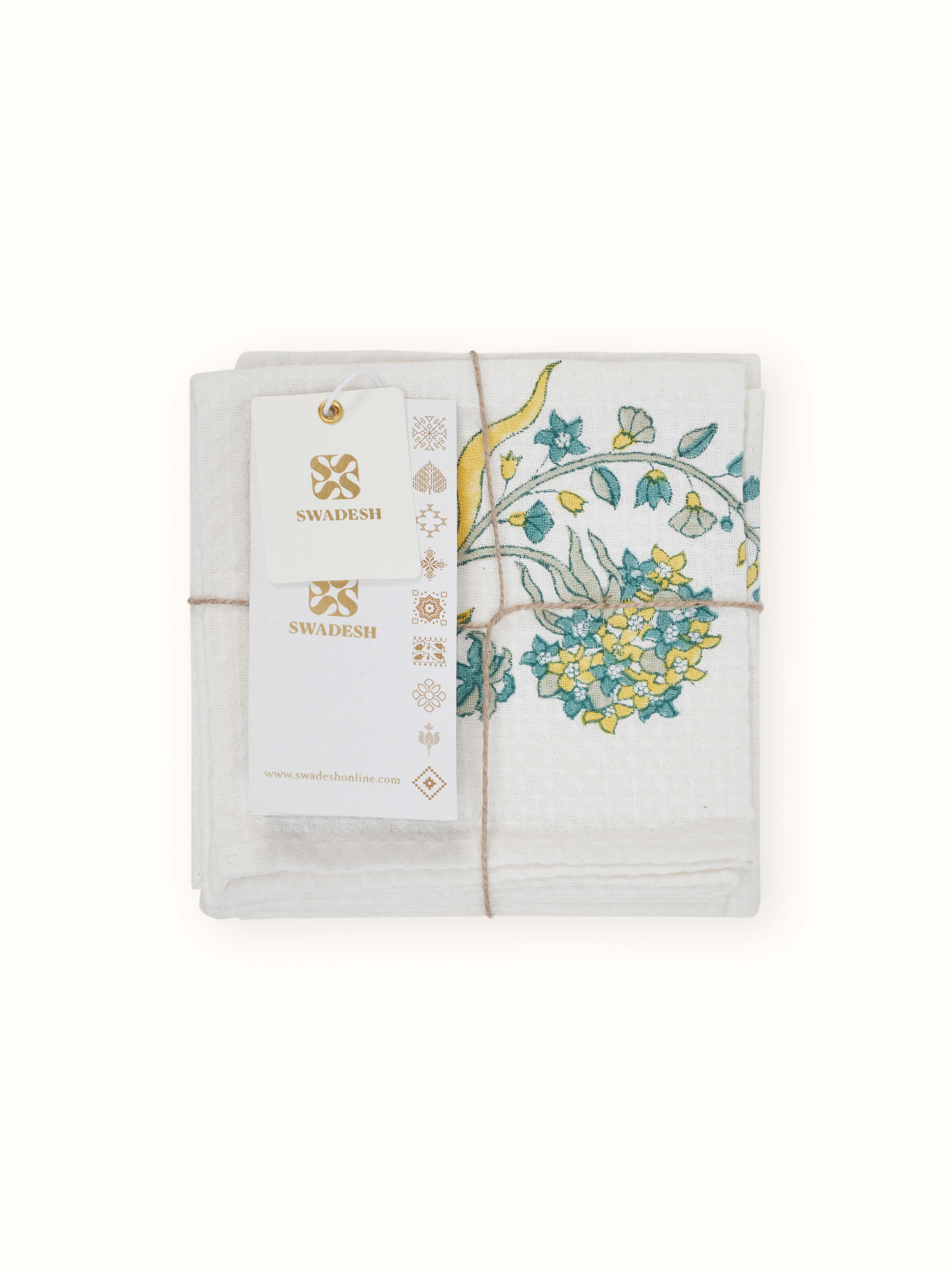 Side view of Palampore yellow floral cotton Sanganeri block printed face towels highlighting the thickness and floral pattern