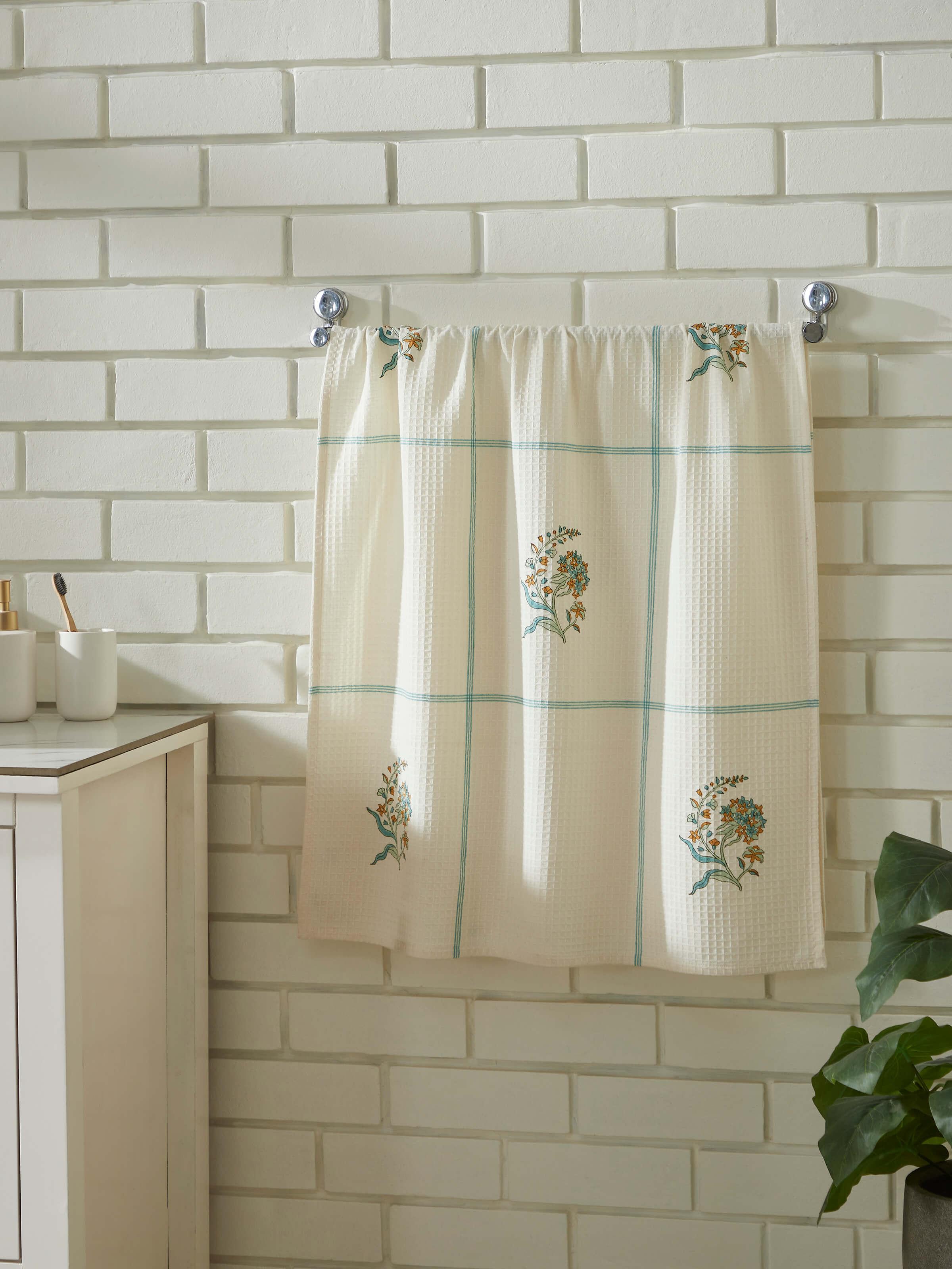Close-up of Palampore buta white cotton bath towel, showing the detailed floral Sanganeri block print.