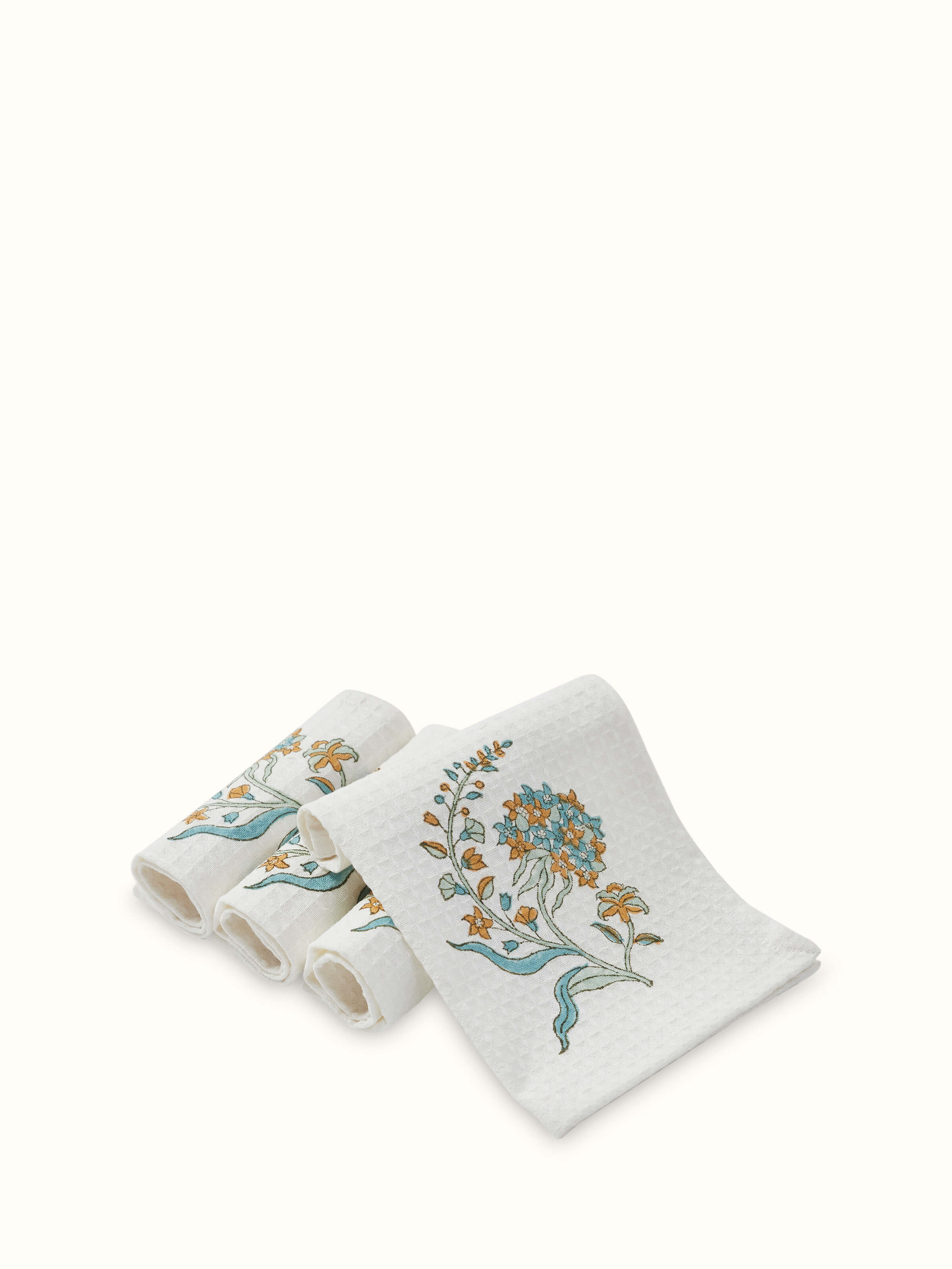 Set of Palampore white floral cotton face towels with Sanganeri block print, highlighting the intricate floral design.