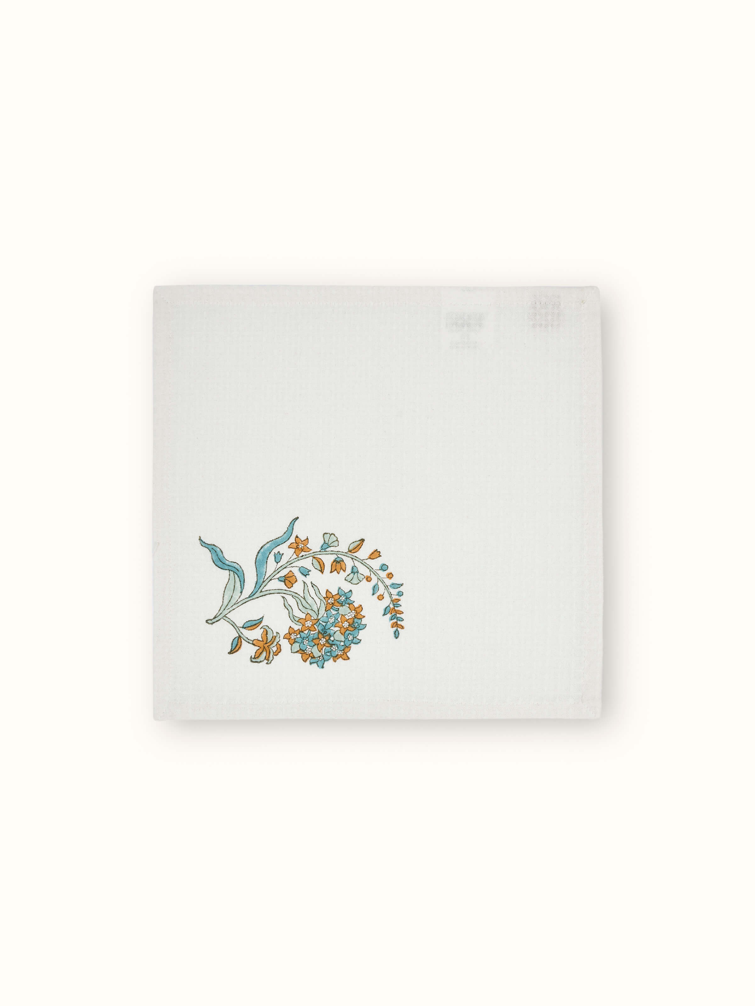 Full view of Palampore white floral cotton face towels arranged to show the Sanganeri block print and overall design.