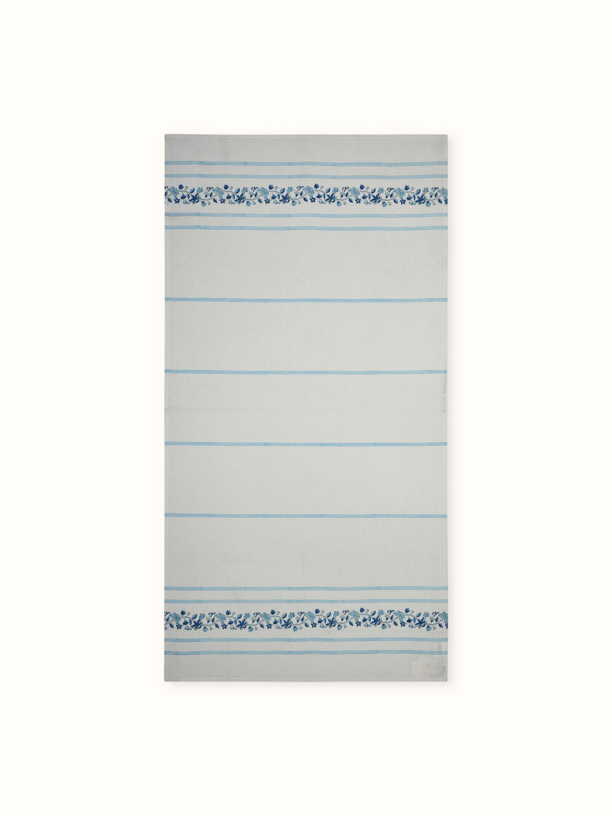 Full view of Palampore blue floral cotton bath towel with Sanganeri block print and stripe design