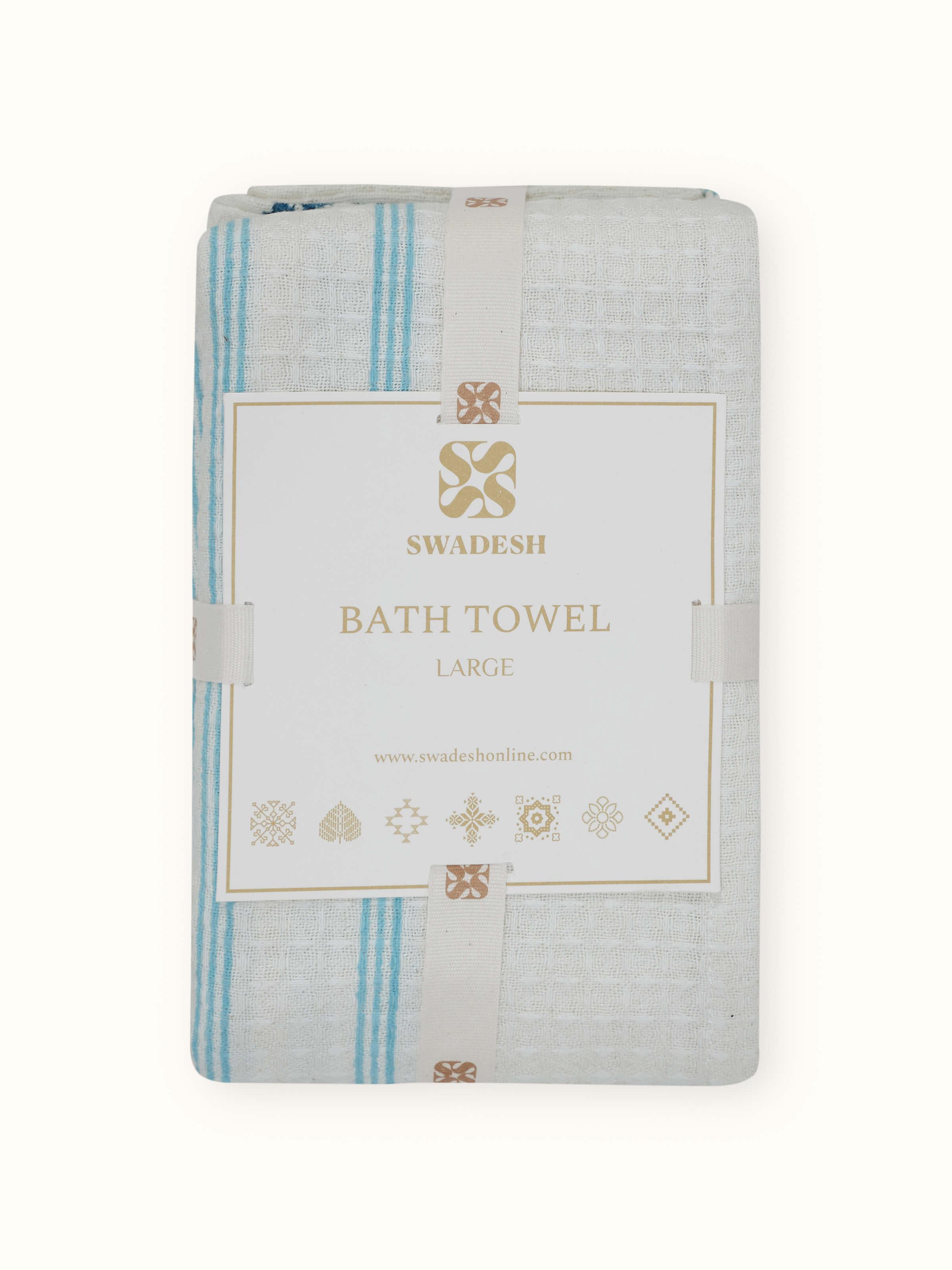 Full view of Palampore blue floral cotton bath towel with Sanganeri block print and stripe design, showcasing intricate patterns and color details.
