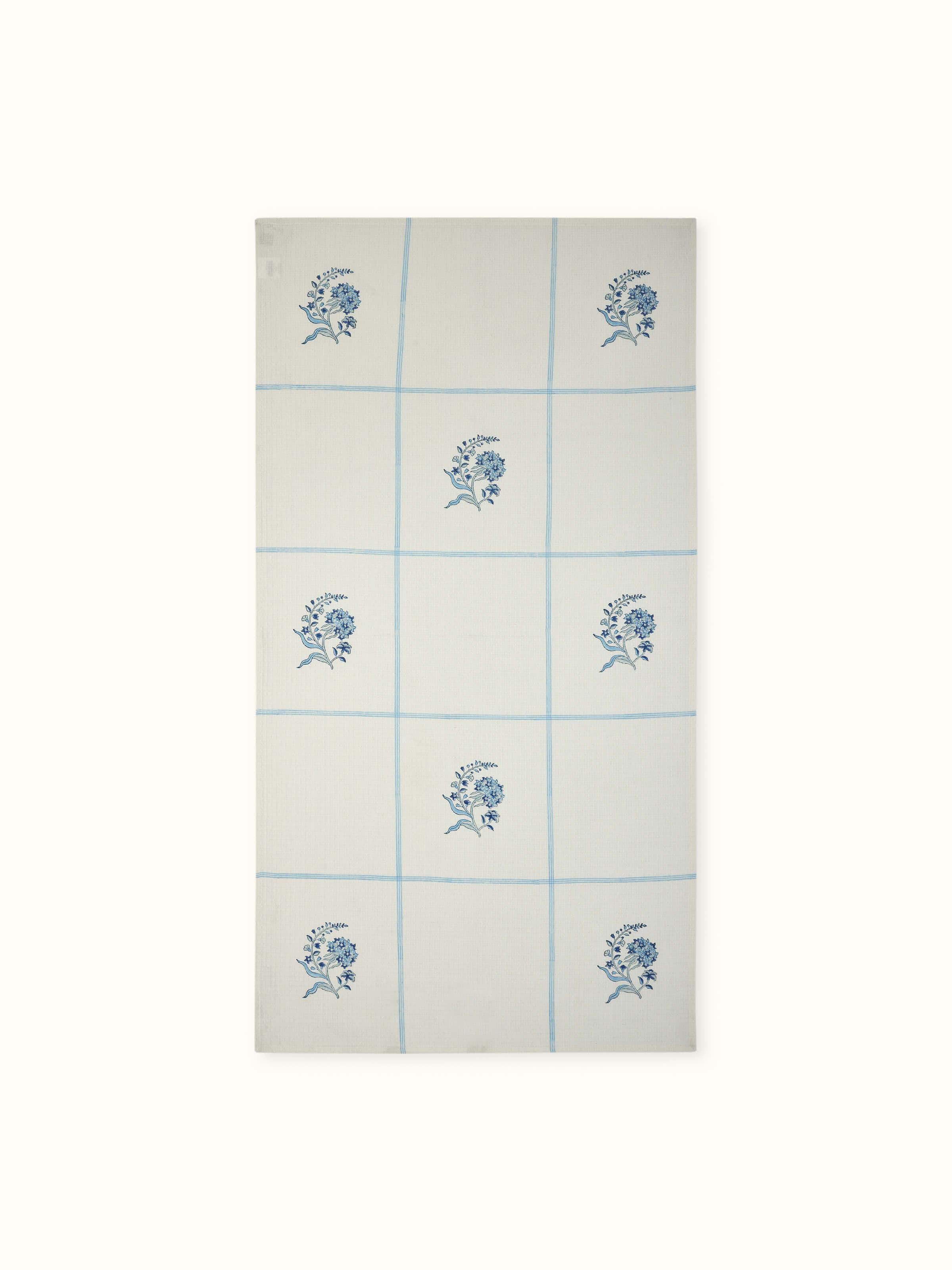 Full view of Palampore Buta blue floral cotton Sanganeri block printed bath towel (L) showcasing its vibrant floral Sanganeri block print and soft cotton fabric.