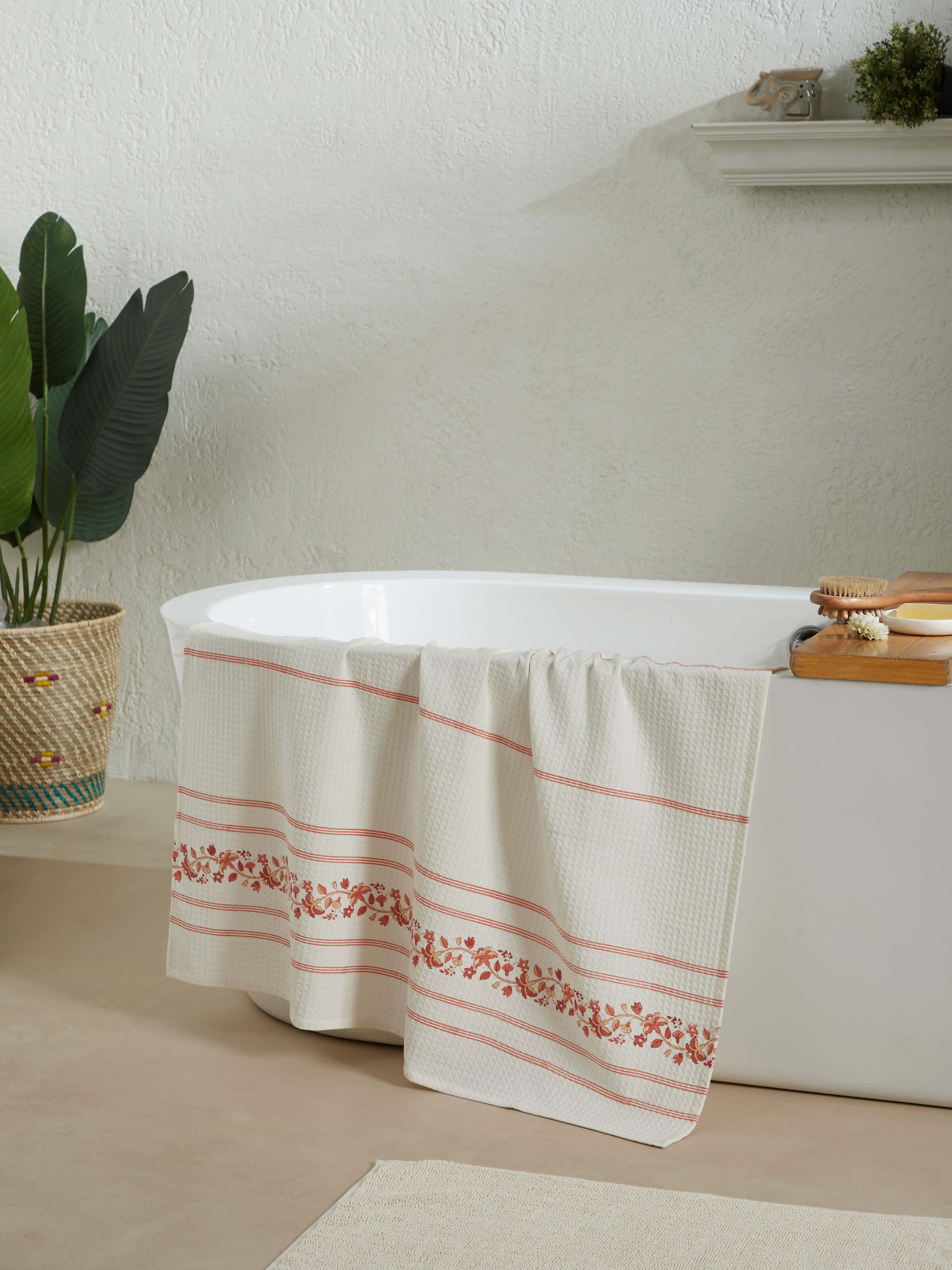Close-up of Palampore stripe peach floral cotton Sanganeri block printed bath towel (XL), highlighting the floral block print and texture.