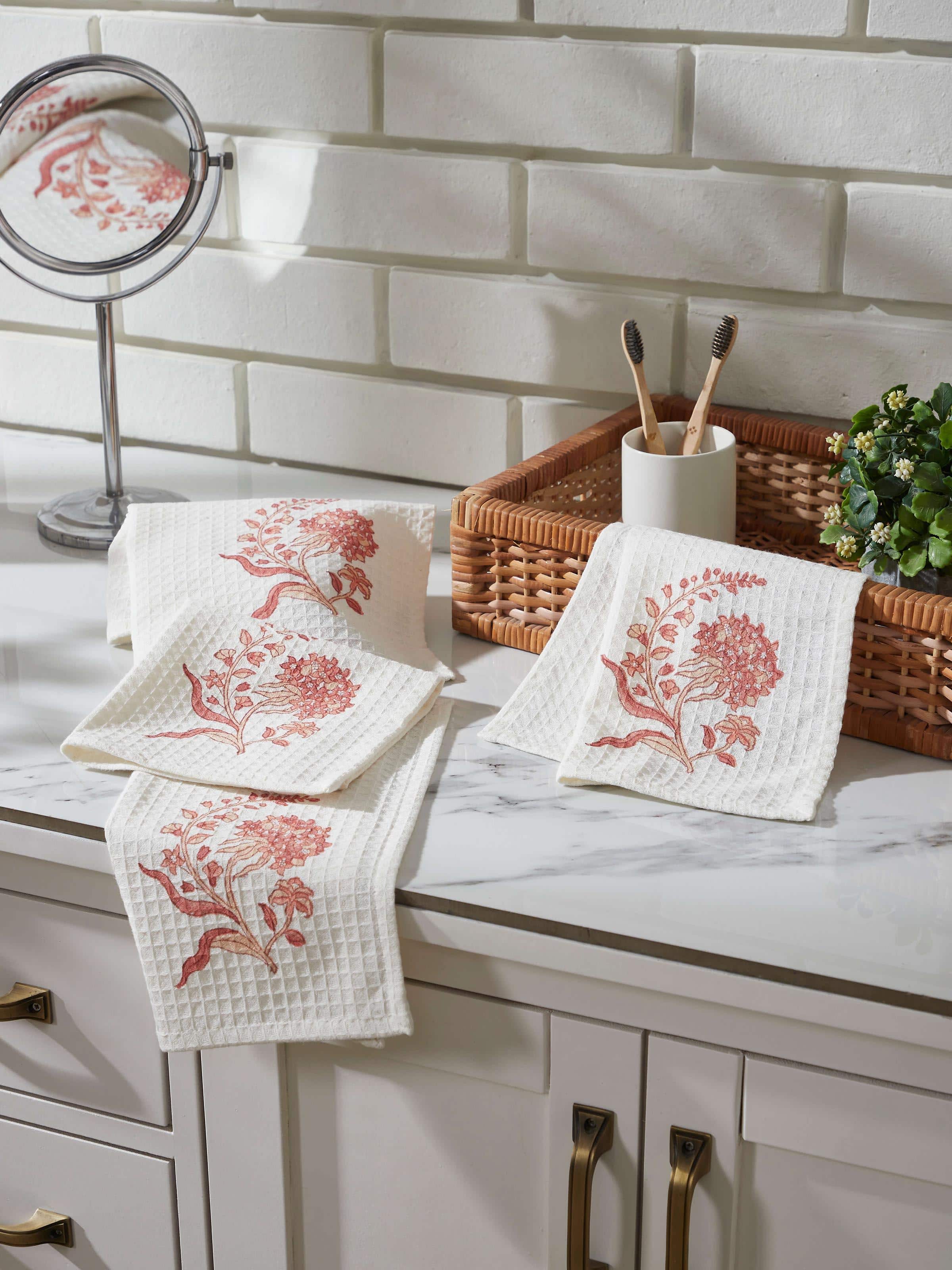 Close-up of Palampore peach floral cotton face towel featuring Sanganeri block print and soft fabric texture.