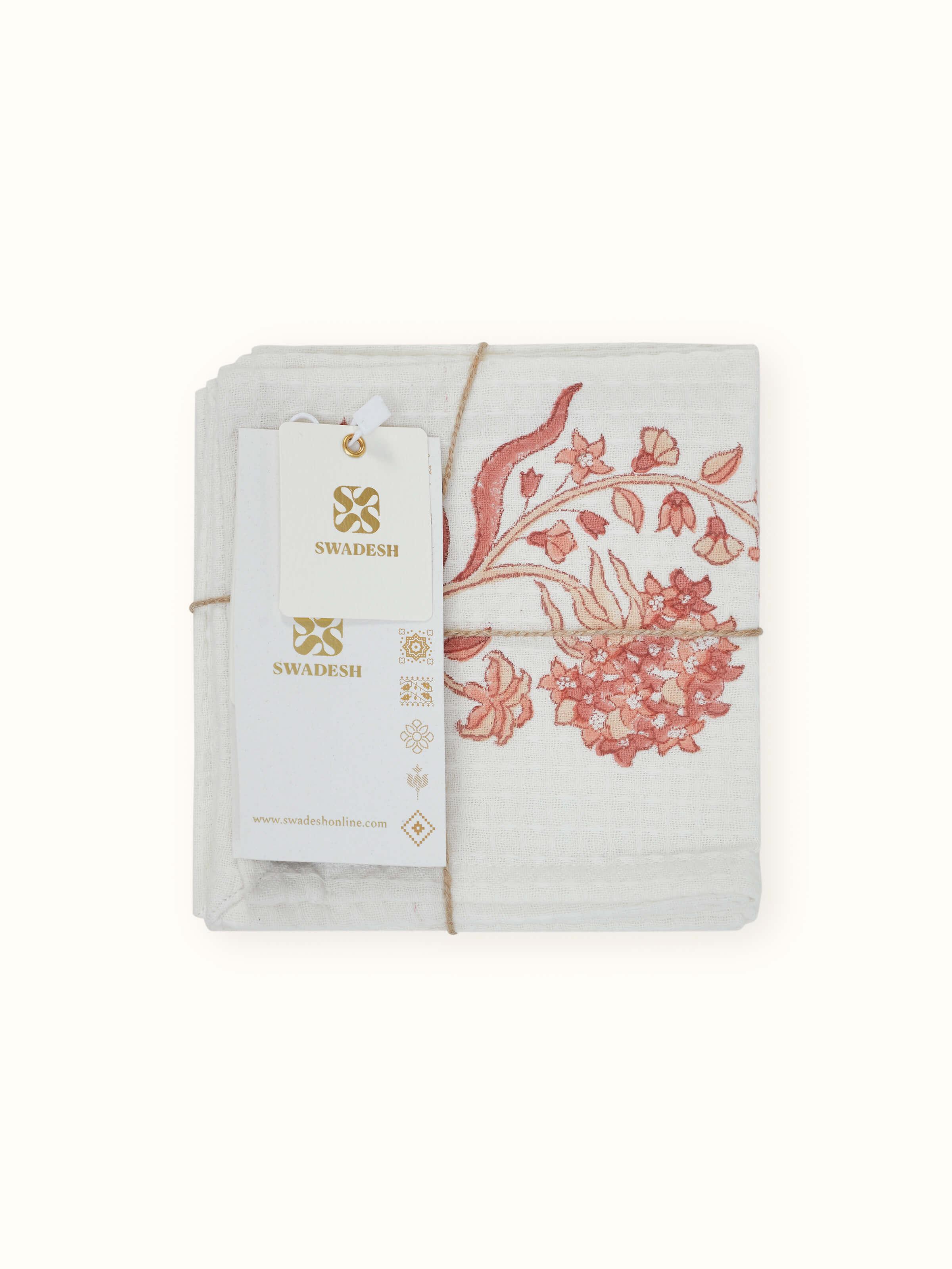 Set of Palampore peach floral cotton face towels displayed to highlight the Sanganeri block print and fabric softness.