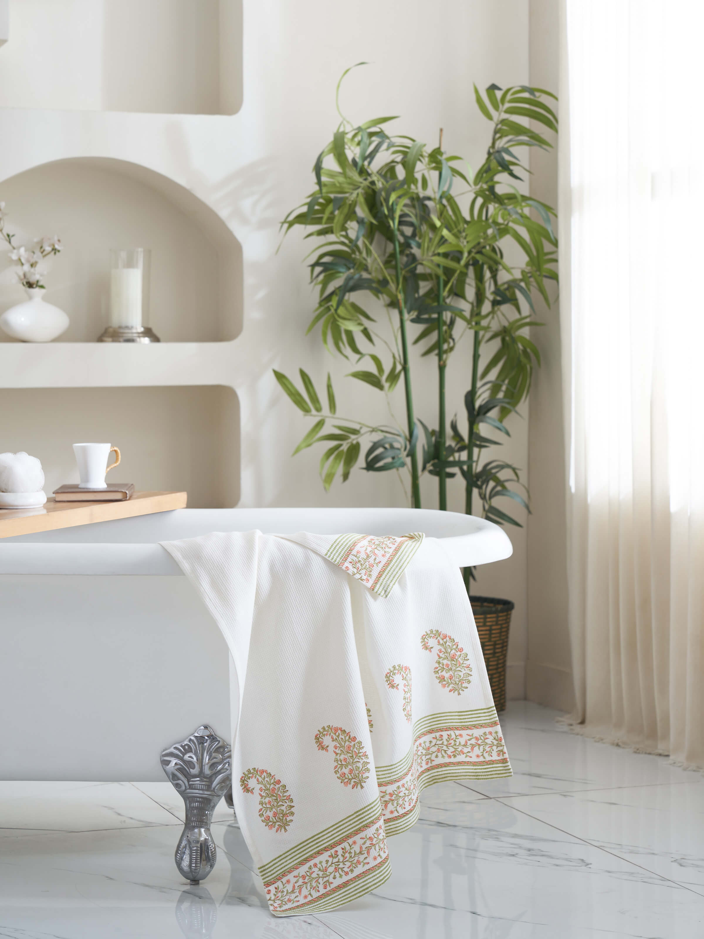 Close-up of Ambi border peach floral cotton Sanganeri block printed bath towel (XL) highlighting the peach floral block print and border details.