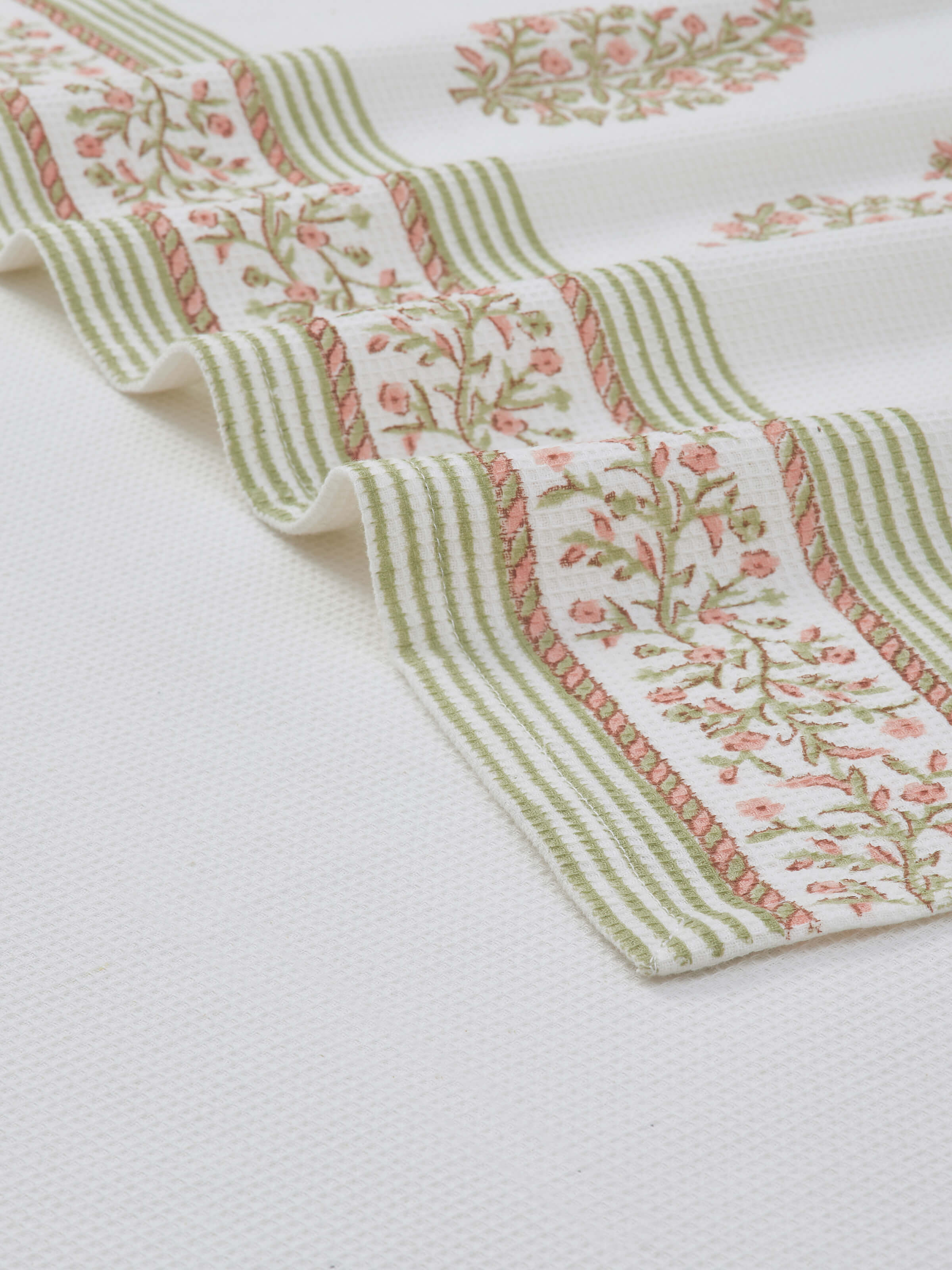 Full view of Ambi border peach floral cotton Sanganeri block printed bath towel (XL) showcasing the peach floral design and generous size.