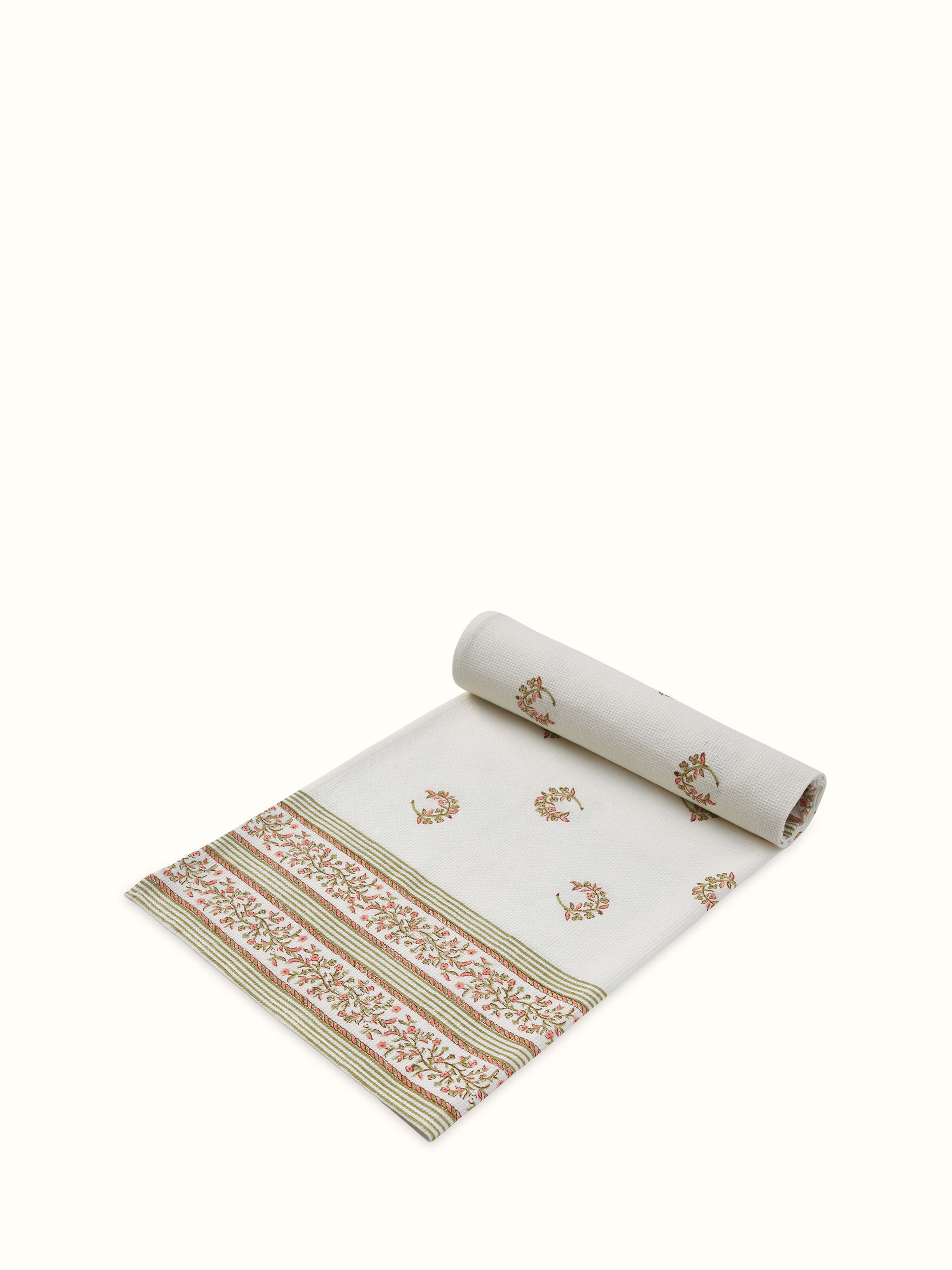 Close-up view of Ambi allover peach floral cotton Sanganeri block printed bath towel (L), focusing on the block print details.