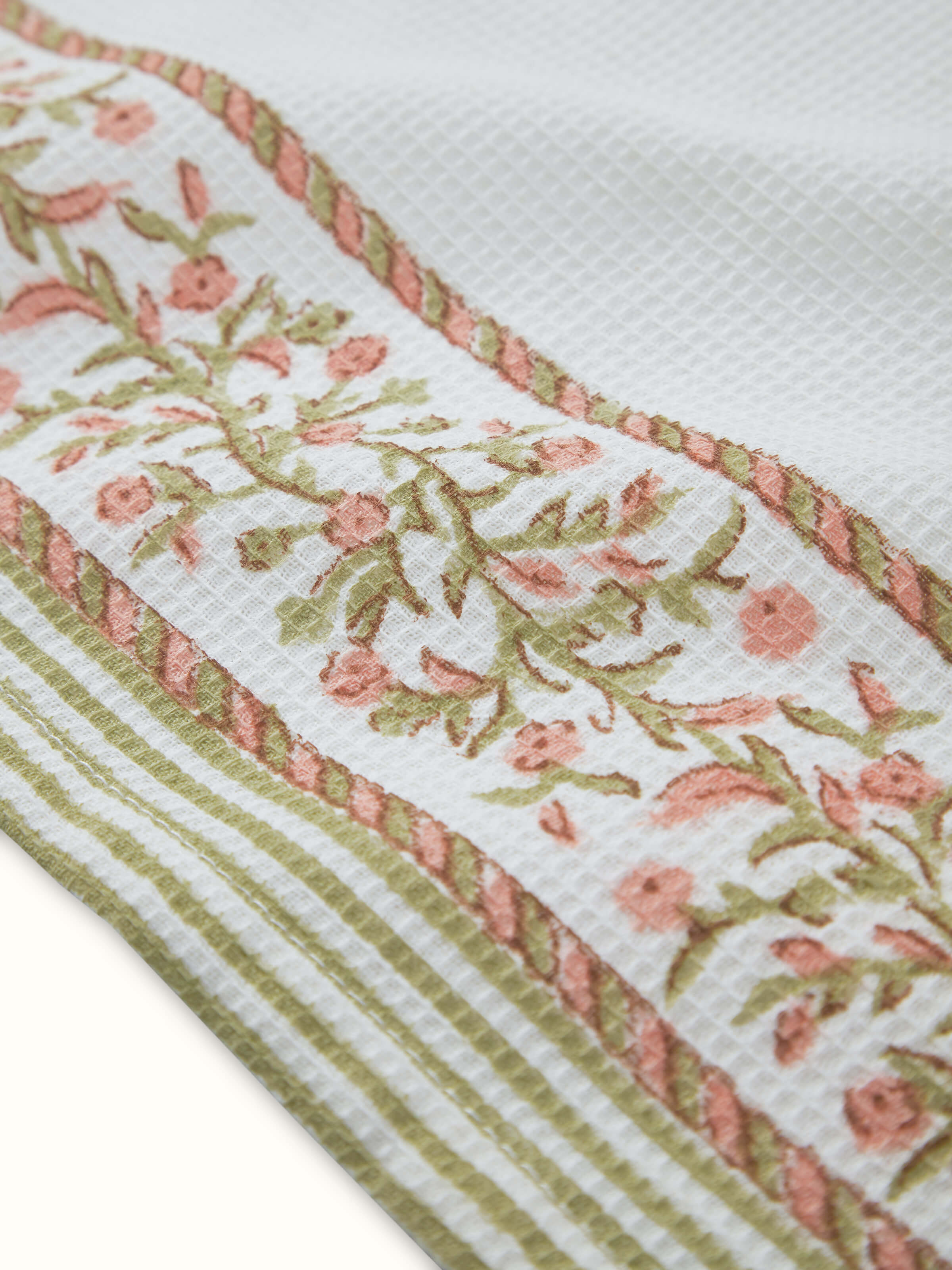 Ambi Stripe Peach Floral Cotton Sanganeri Block Printed Hand Towels laid out, highlighting the floral and stripe patterns.
