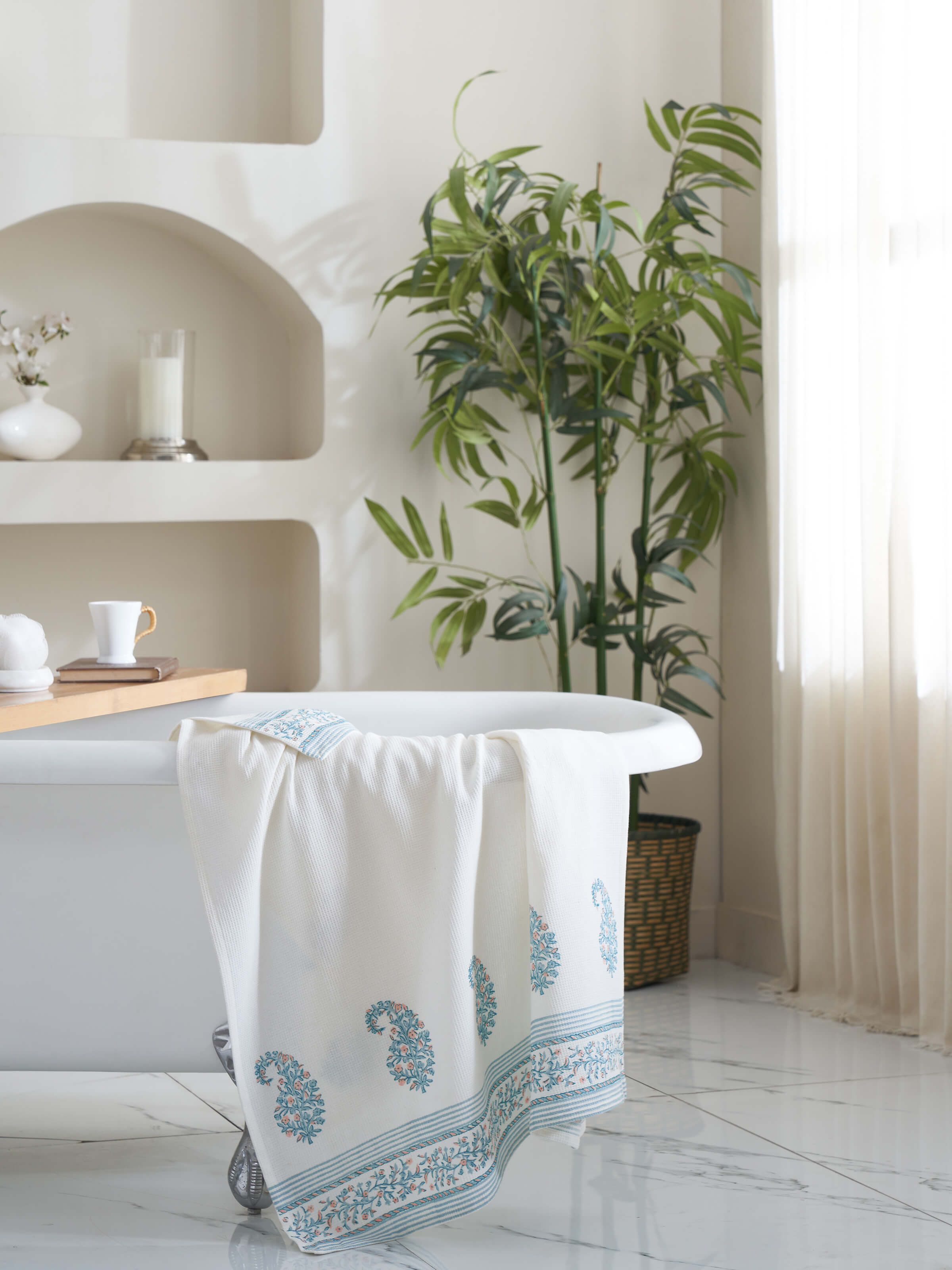 Close-up of Ambi border blue floral cotton Sanganeri block printed bath towel (XL), highlighting the floral pattern.