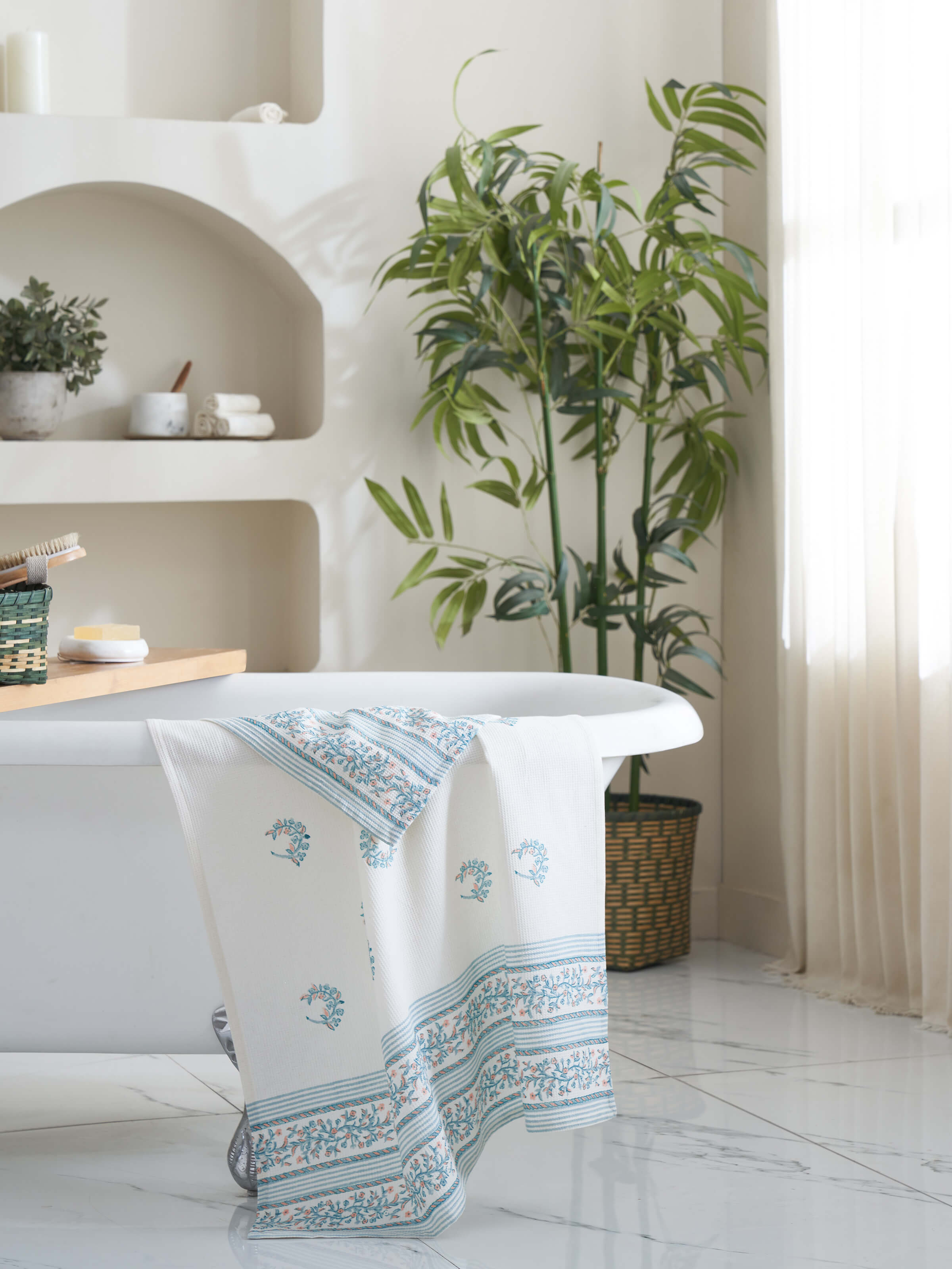 Close-up of Ambi allover blue floral cotton Sanganeri block printed bath towel (L) showcasing the intricate blue floral block print.