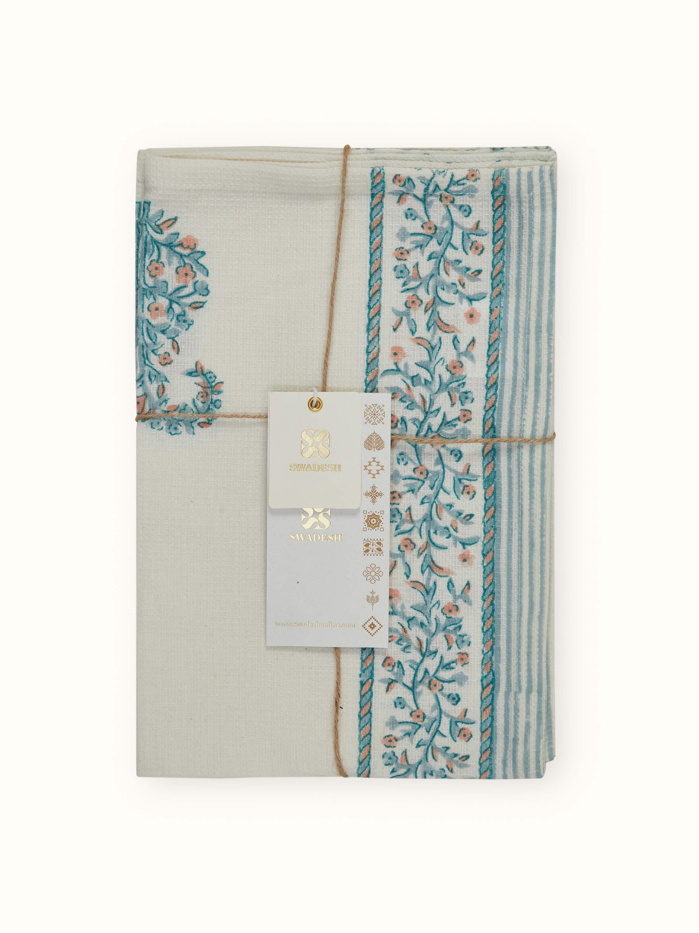 Detailed view of the Ambi stripe blue floral cotton hand towel, highlighting the texture and design of the Sanganeri block print.