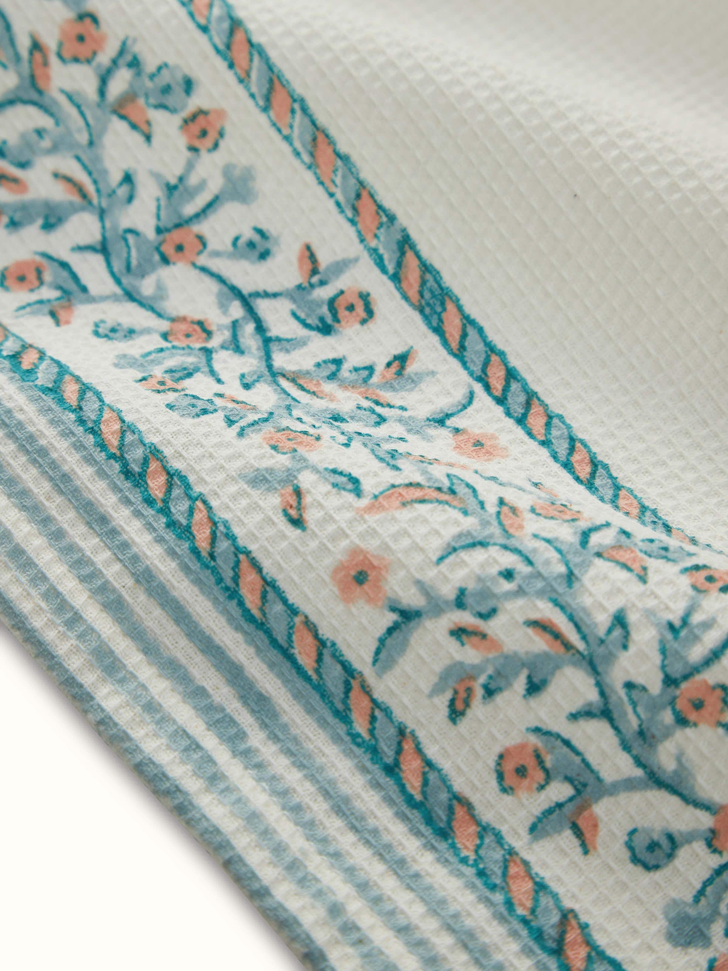 Ambi stripe blue floral cotton hand towel in a grouped arrangement, showcasing the Sanganeri block print on multiple towels.