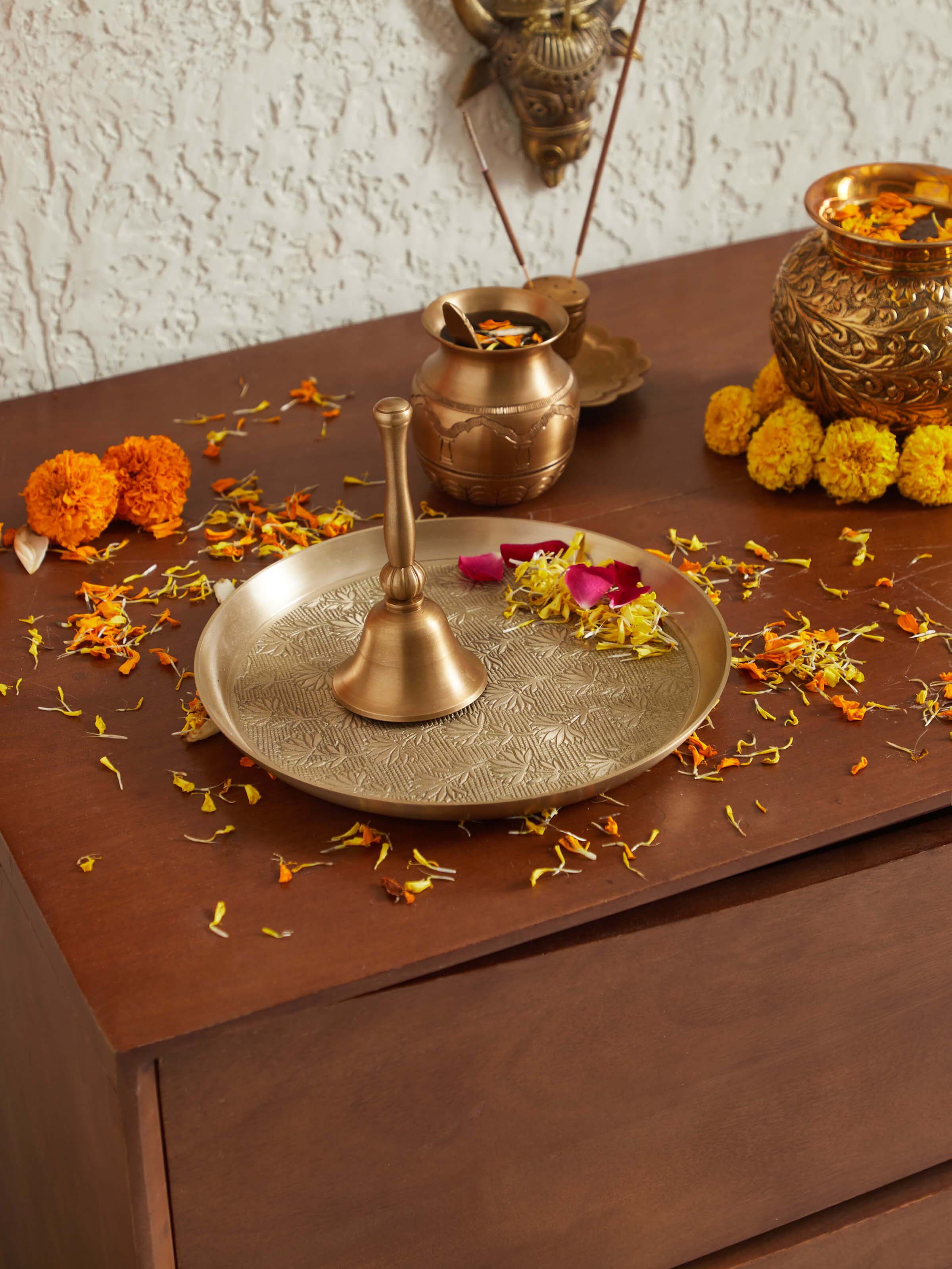 Close-up view of Polished Brass Pooja Bell, focusing on the bell’s ornate details and smooth finish