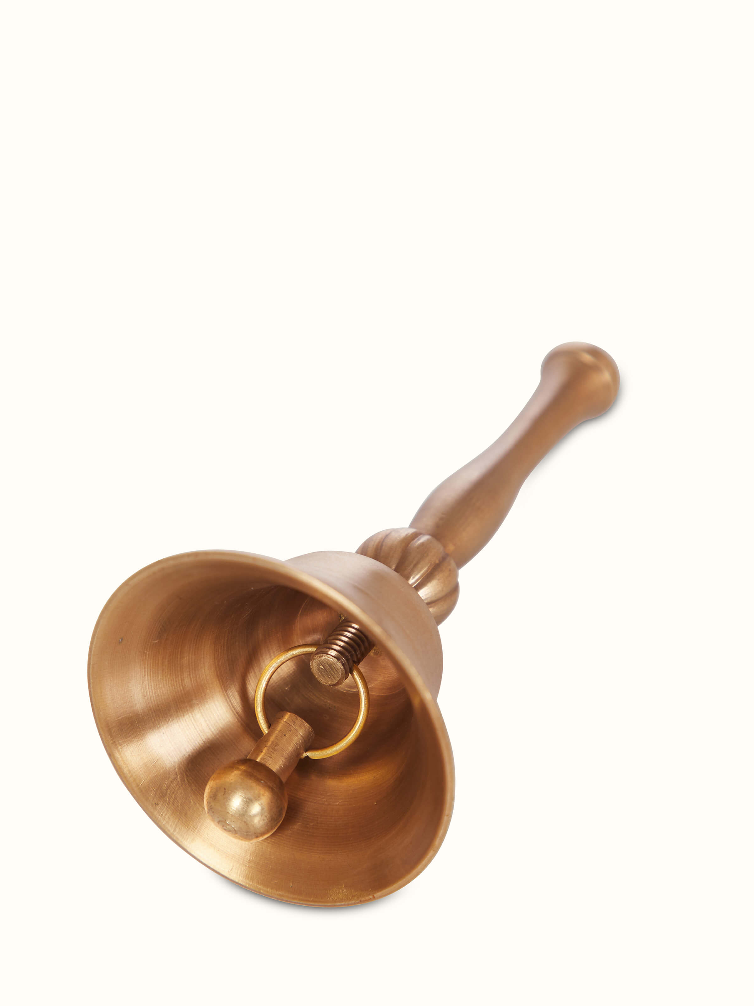 Artistic view of Polished Brass Pooja Bell, displaying the bell from a unique angle