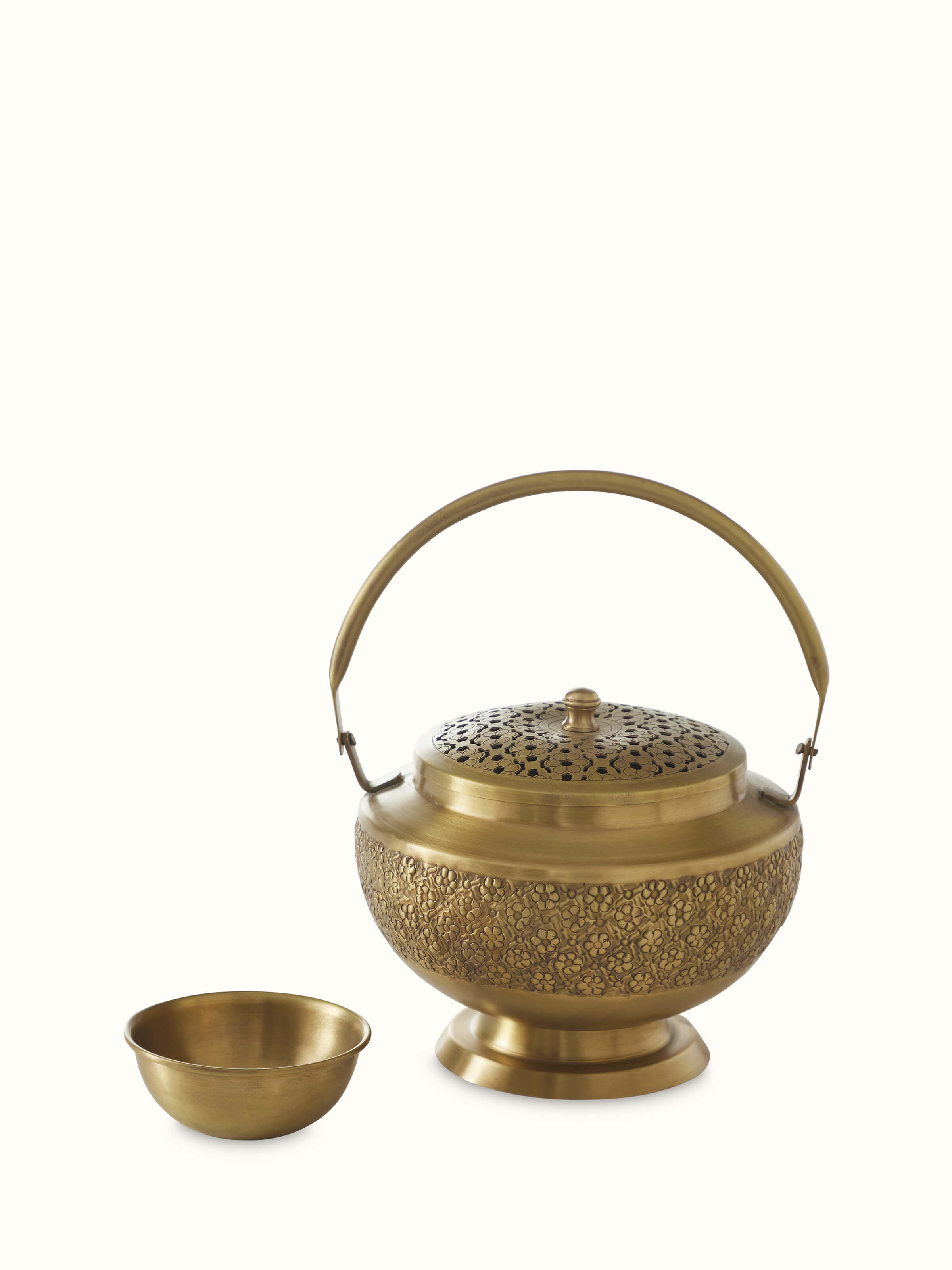 Front view of traditional polished brass dhuna with intricate detailing