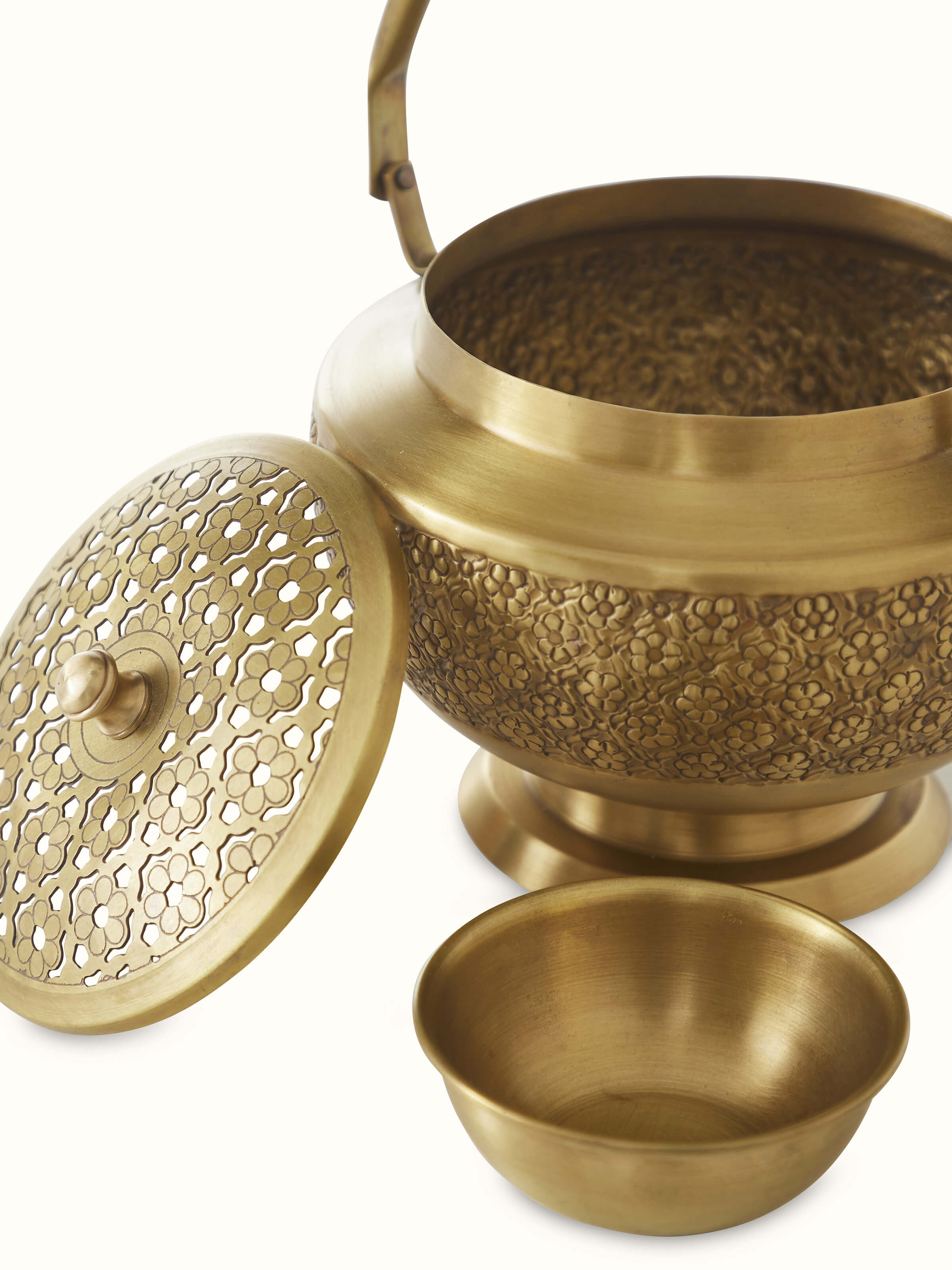 Top view of traditional polished brass dhuna showcasing its traditional design