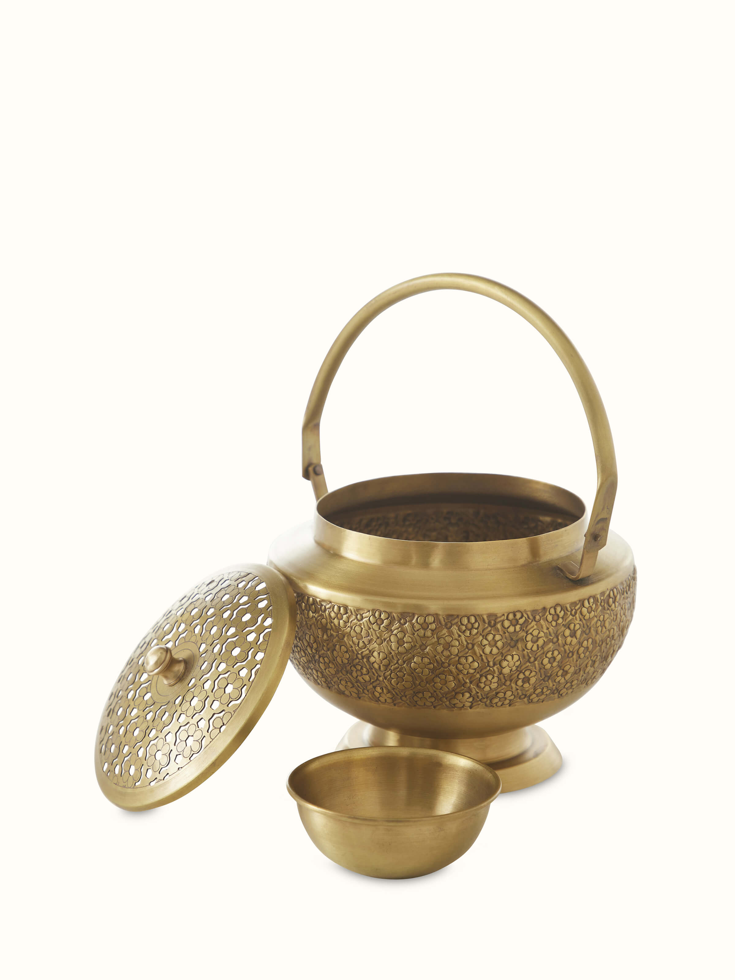 Open view of traditional polished brass dhuna displaying its decorative elements