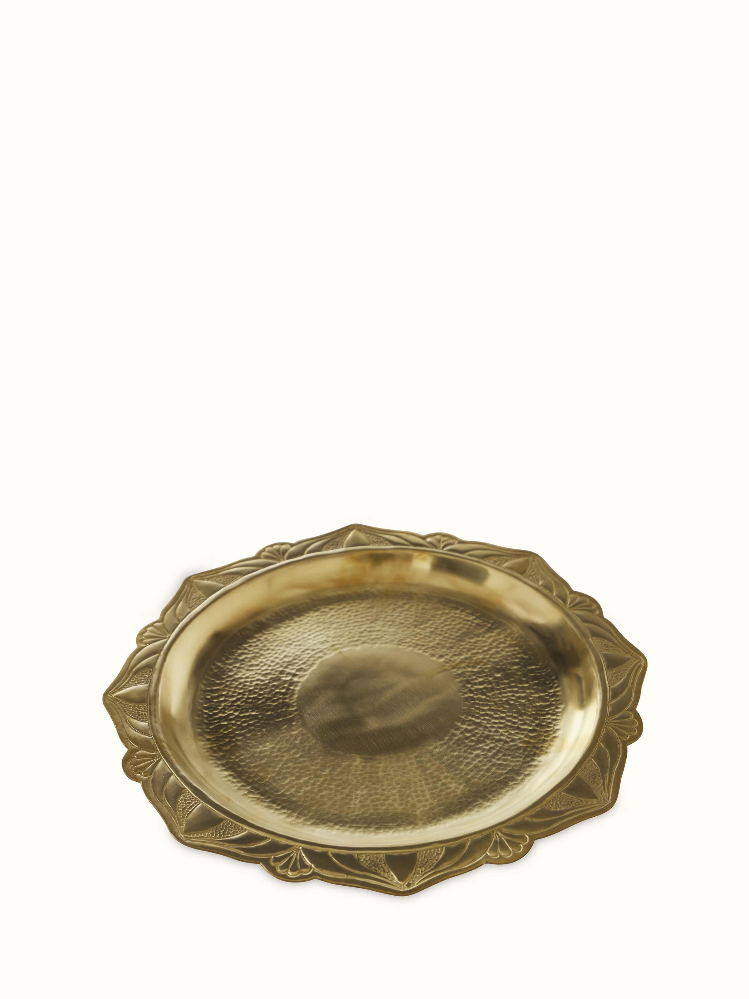 Front view of polished brass ajradha pooja thali, featuring its polished surface