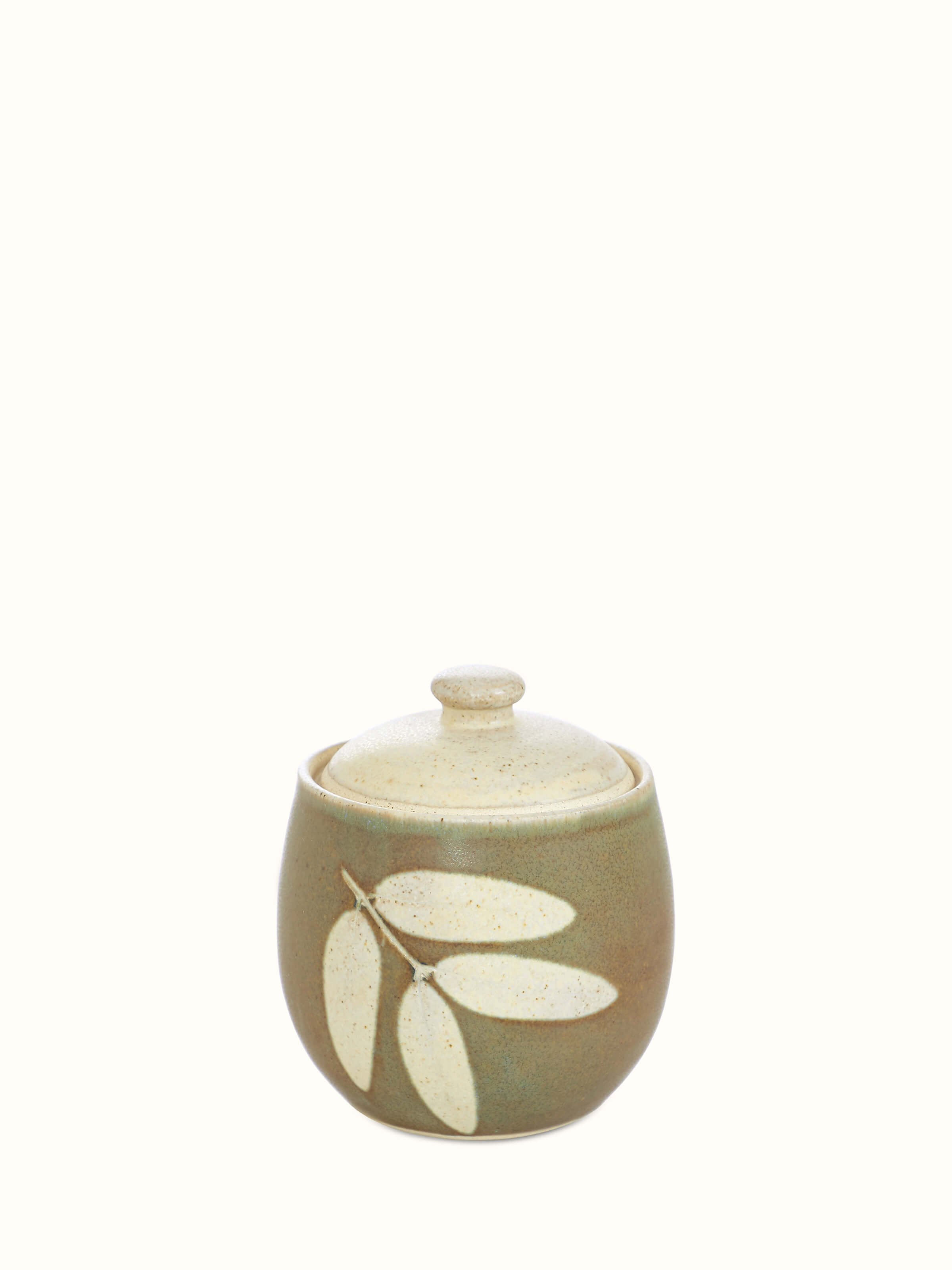 Front view of Studio pottery ceramic jar with lid highlighting the elegant shape and smooth finish