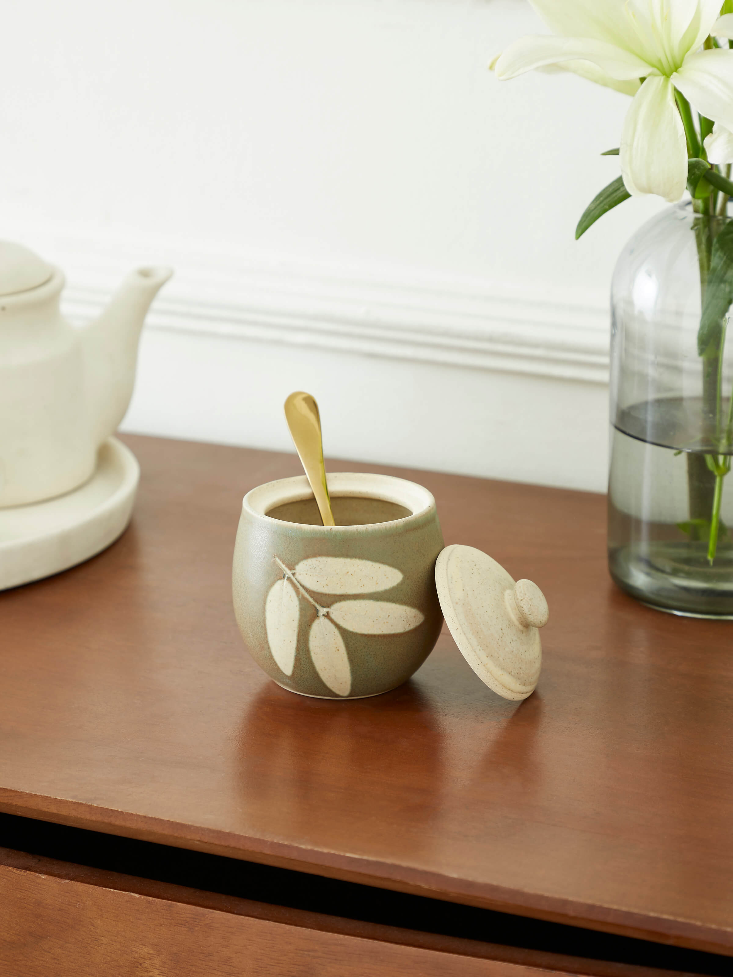 Side view of Studio pottery ceramic jar with lid showcasing detailed craftsmanship and classic design